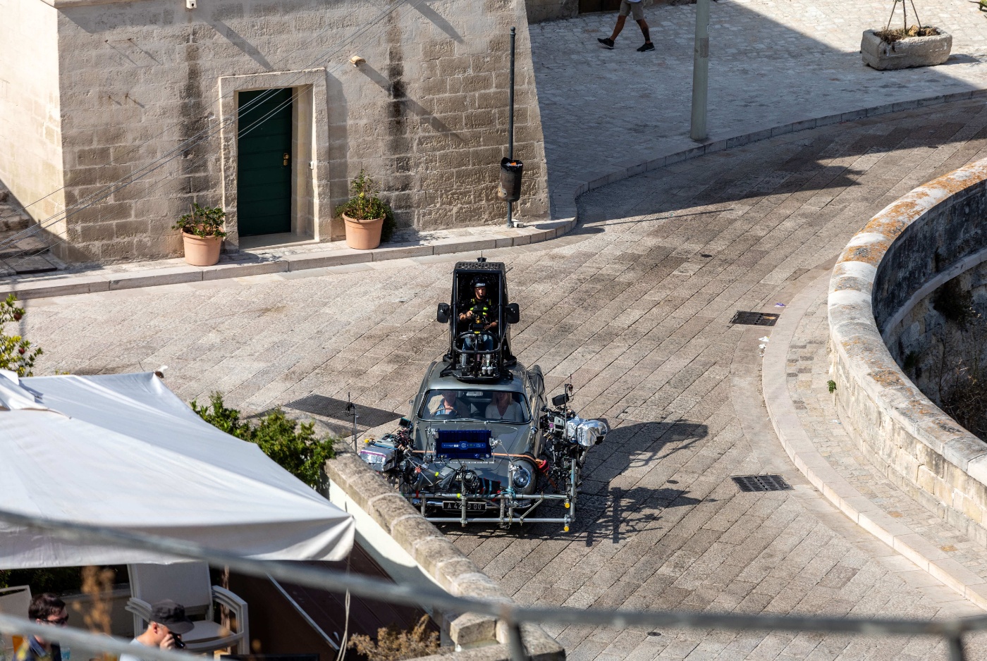 Aston Martin DB5 while filming chase scenes through the narrow streets of the movie "No Time to Die" in Sassi, Italy.