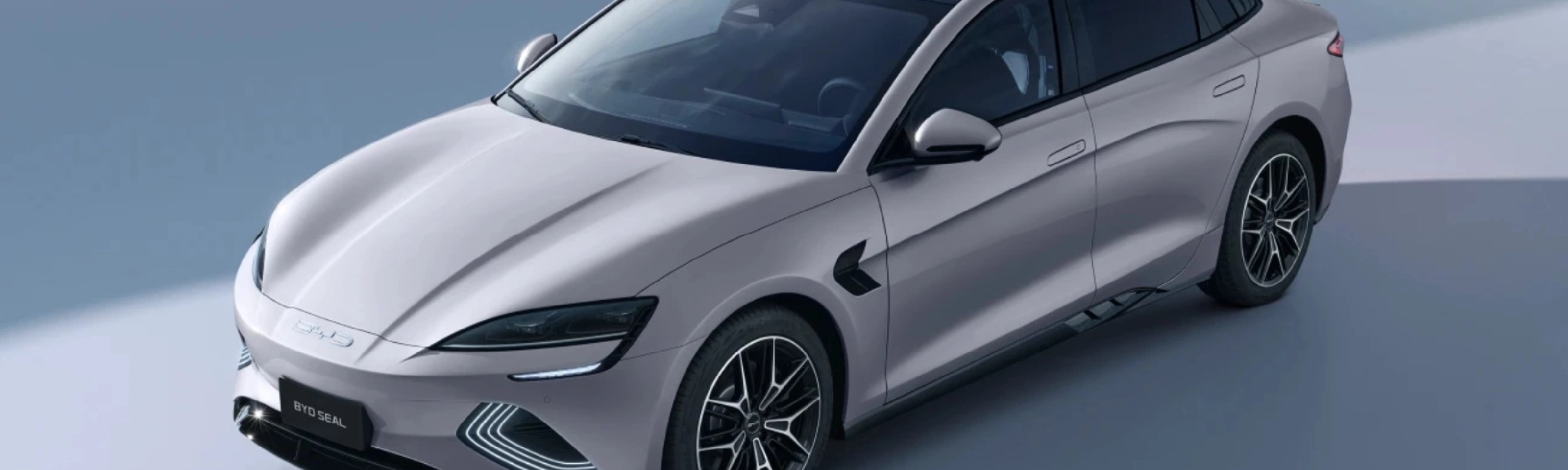BYD Seal electric sedan in light gray, shown from a front-side angle.