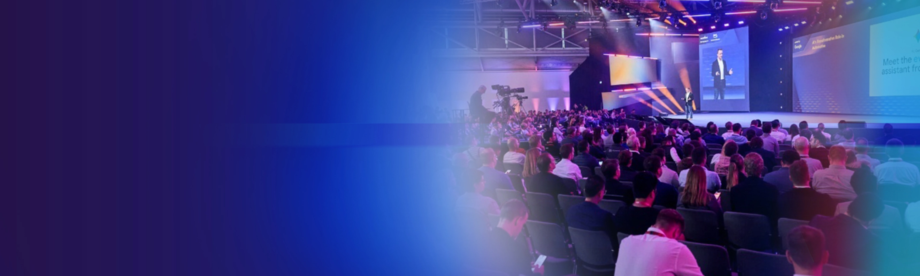 Promotional banner showing a conference audience and stage presentation.