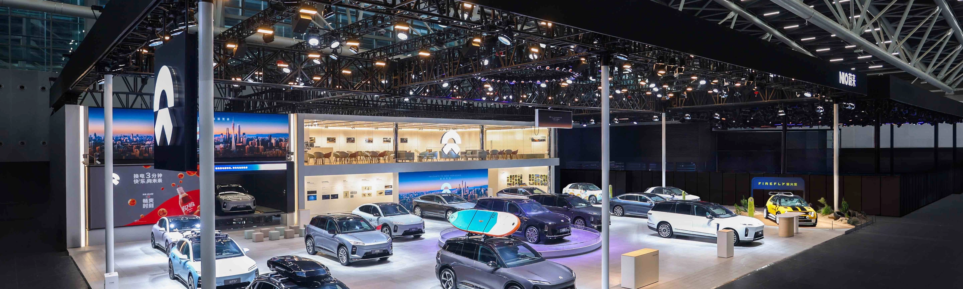 NIO exhibition booth displaying multiple electric cars at an auto show.