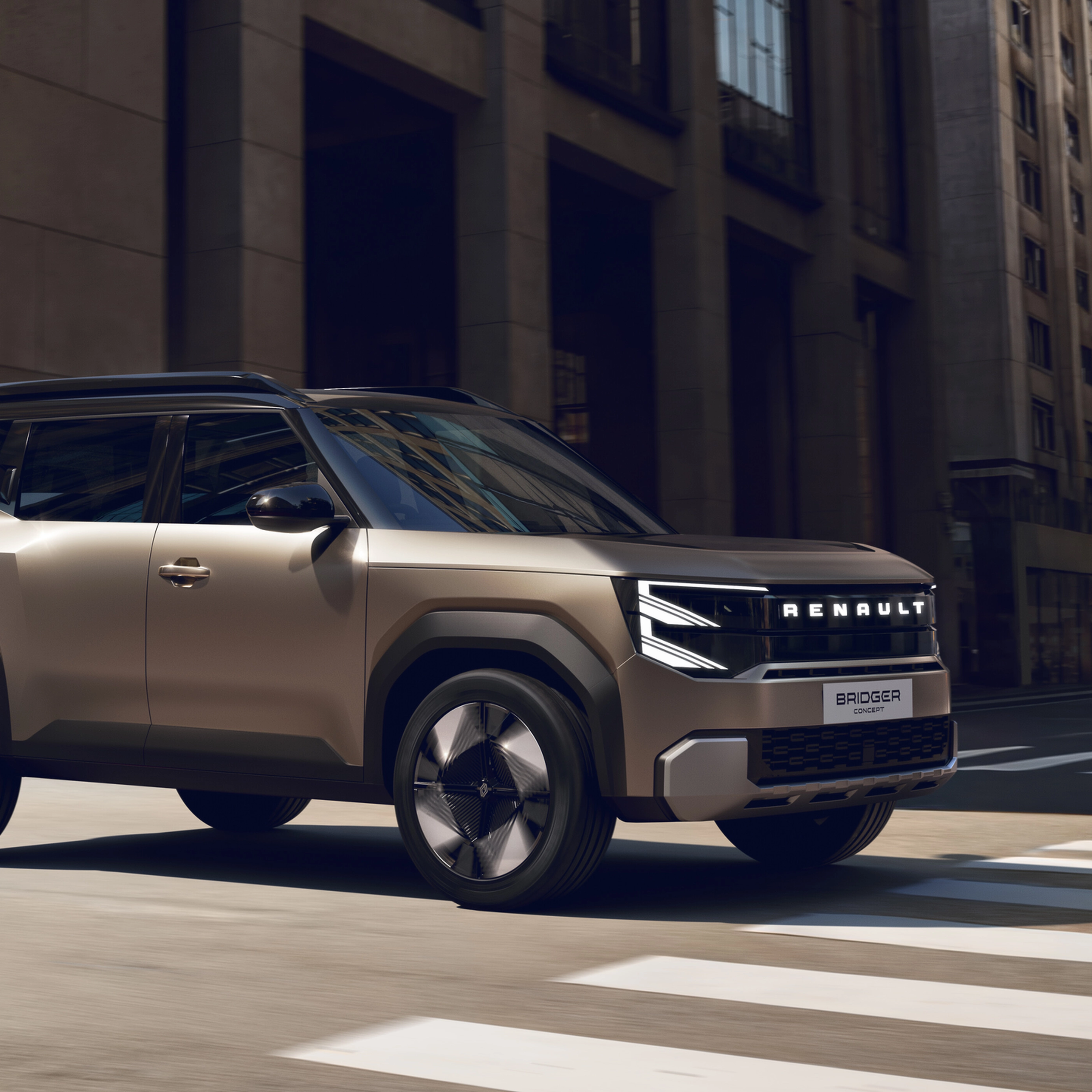 Renault Bridger Concept SUV driving through a modern city street.