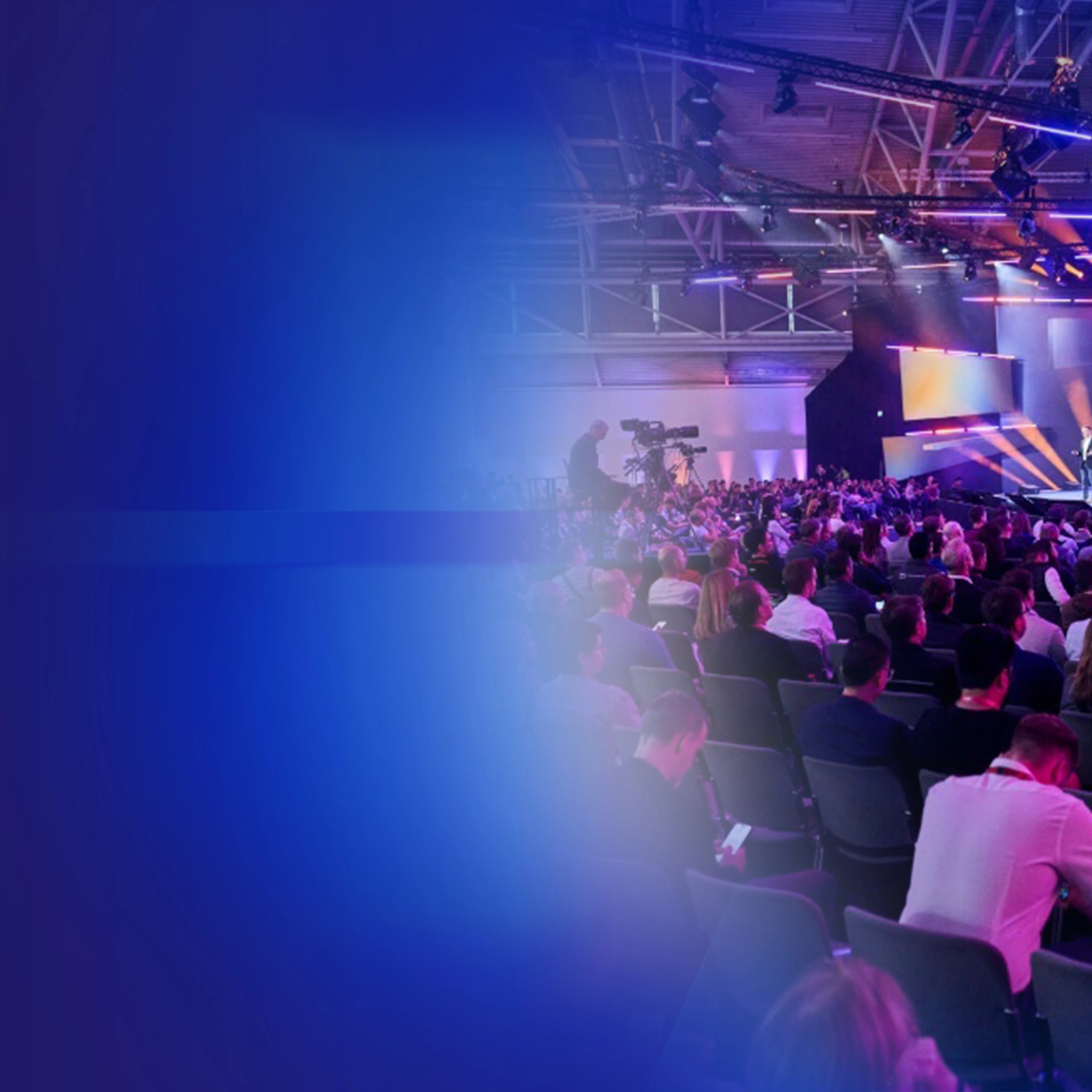 Promotional banner showing a conference audience and stage presentation.