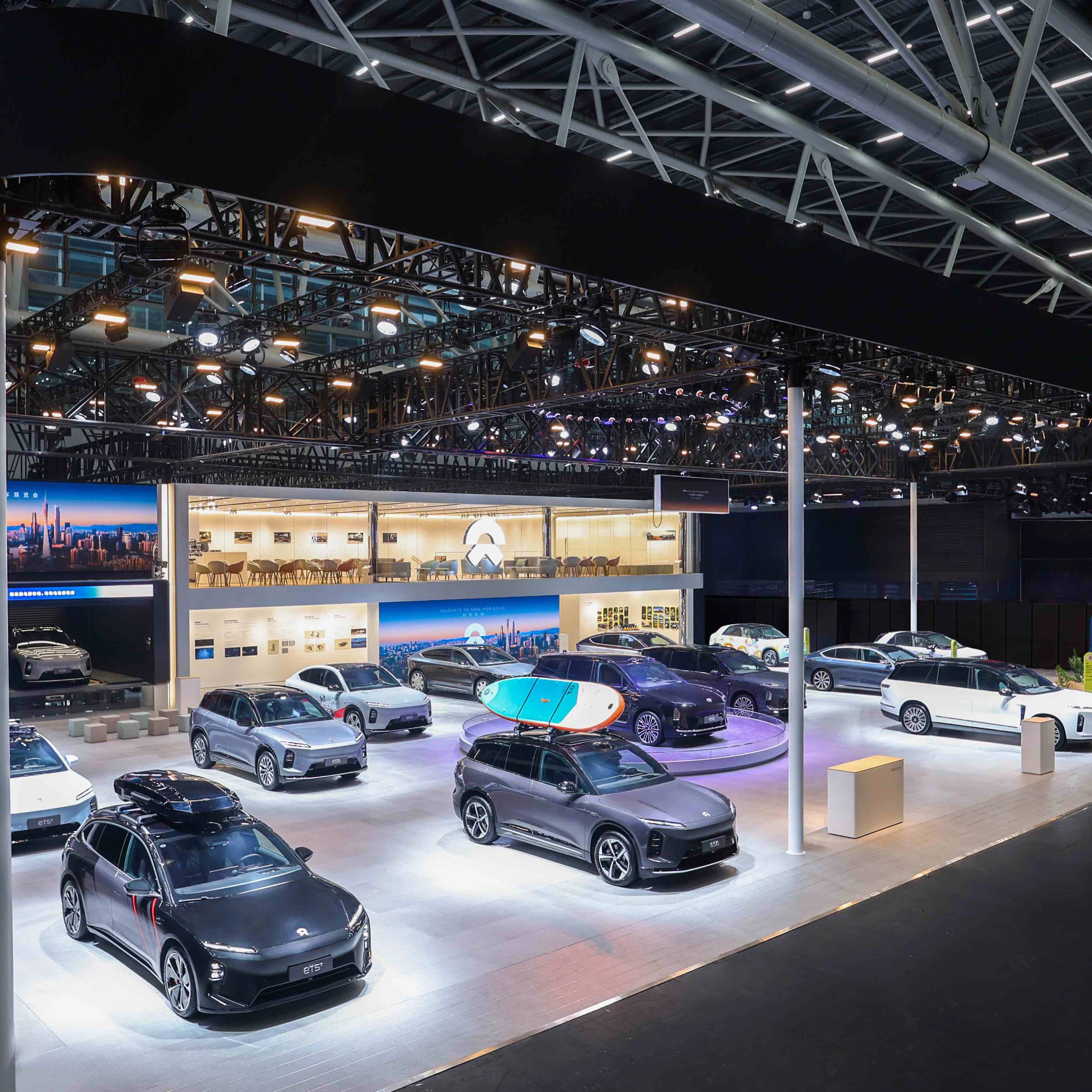 NIO exhibition booth displaying multiple electric cars at an auto show.