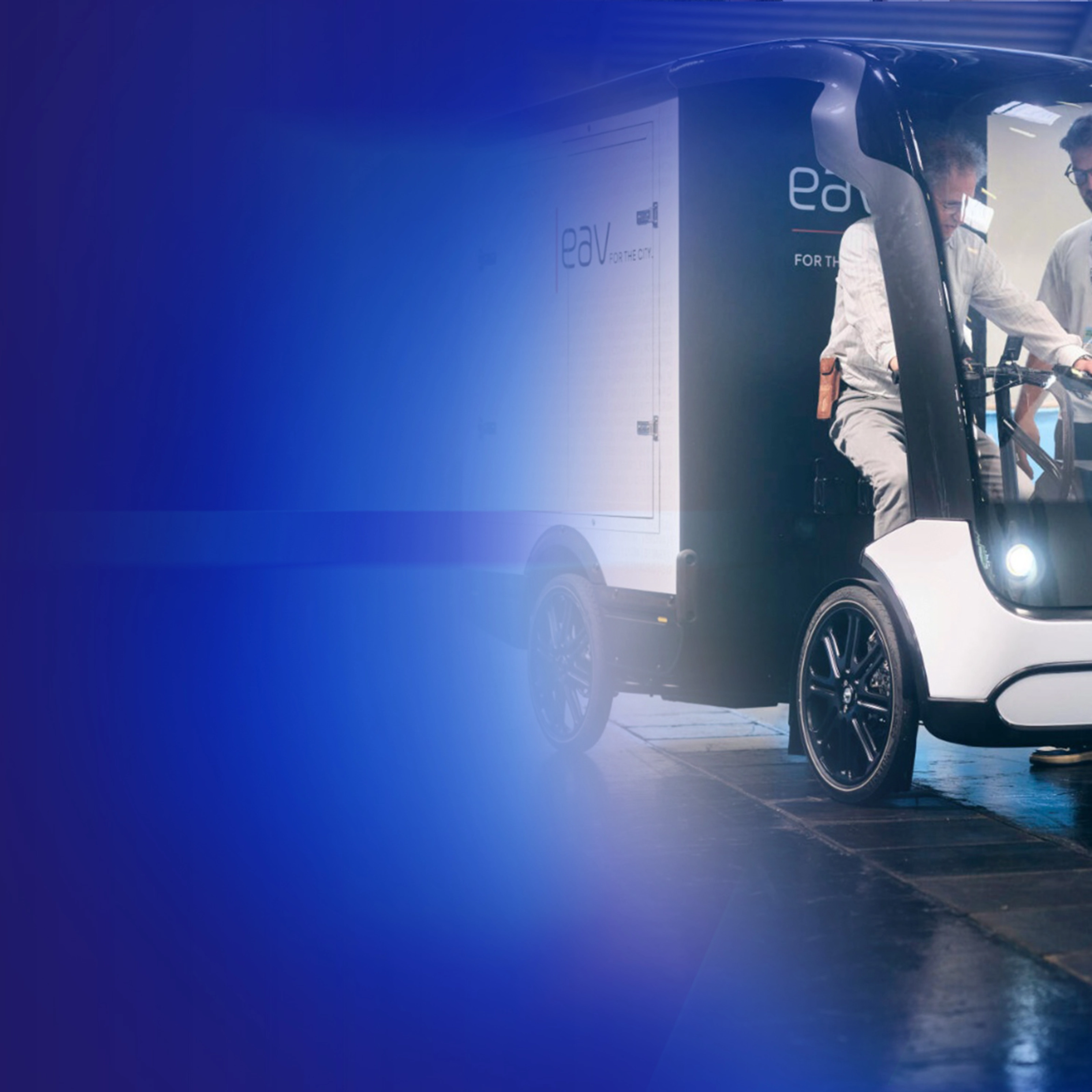 Promotional banner showing an autonomous delivery vehicle on a blue background.