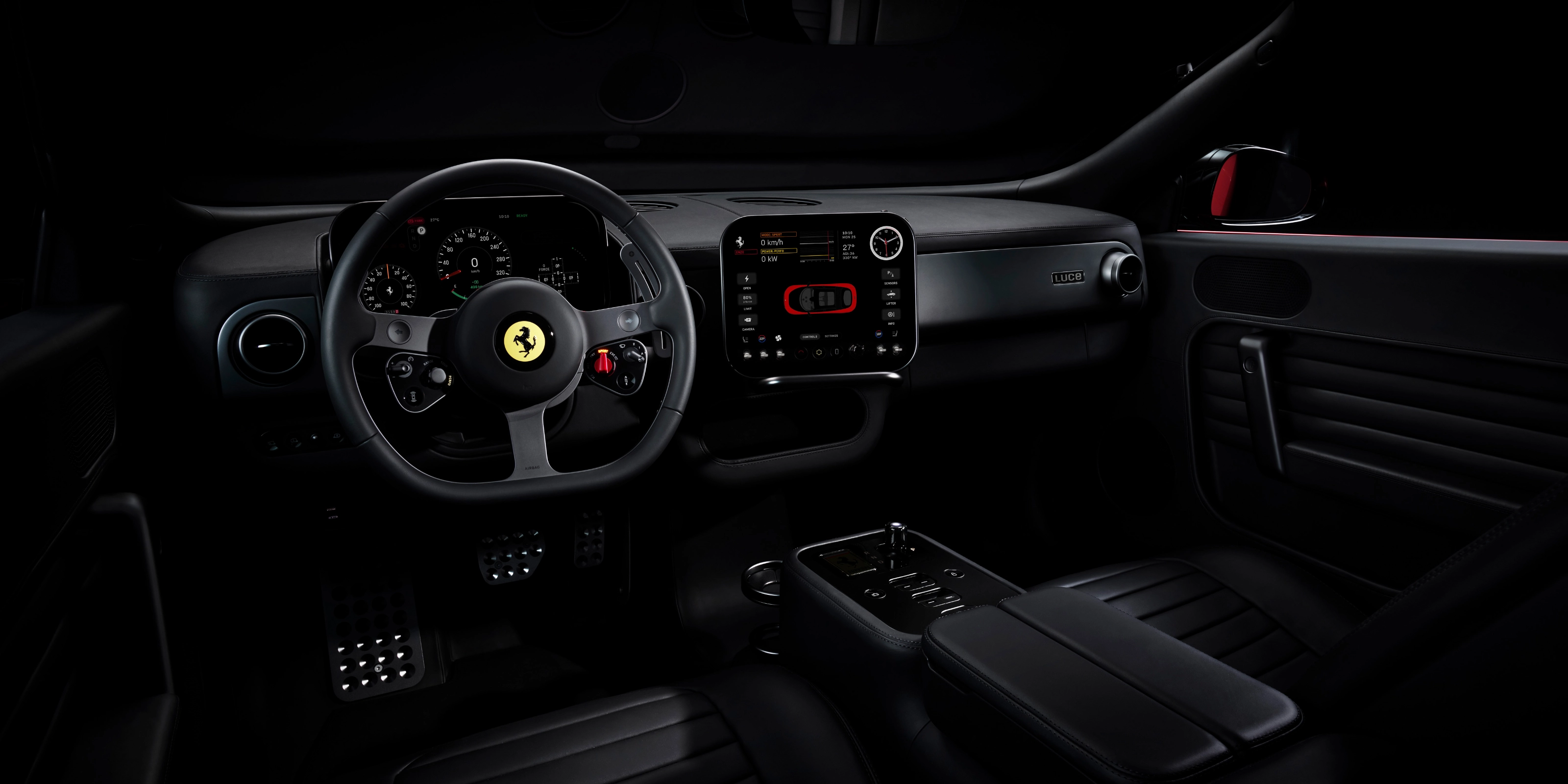 Dark Ferrari interior with illuminated dashboard and steering wheel.