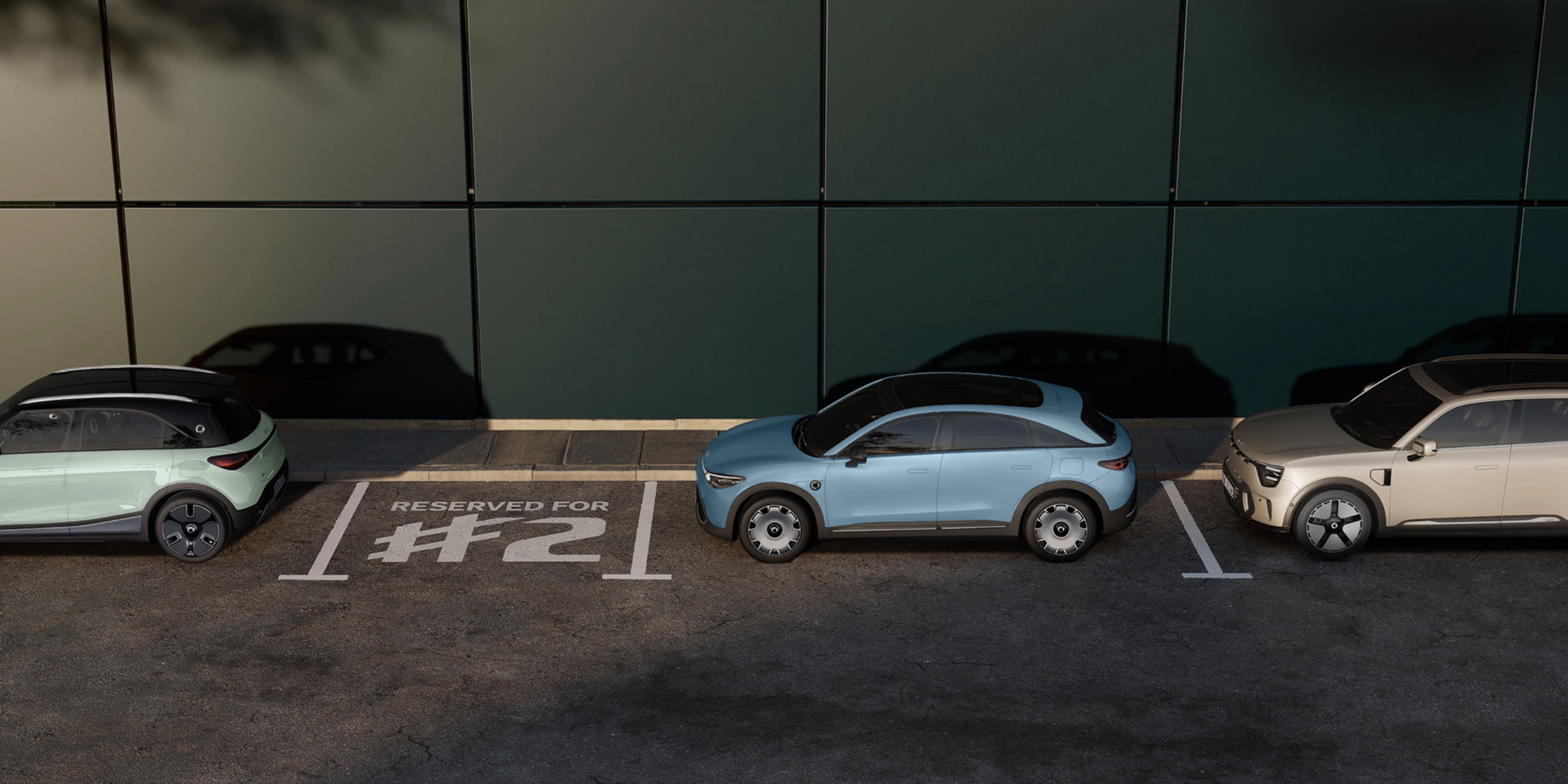 Three parked electric cars in front of a building, with one space marked "Reserved for #2".