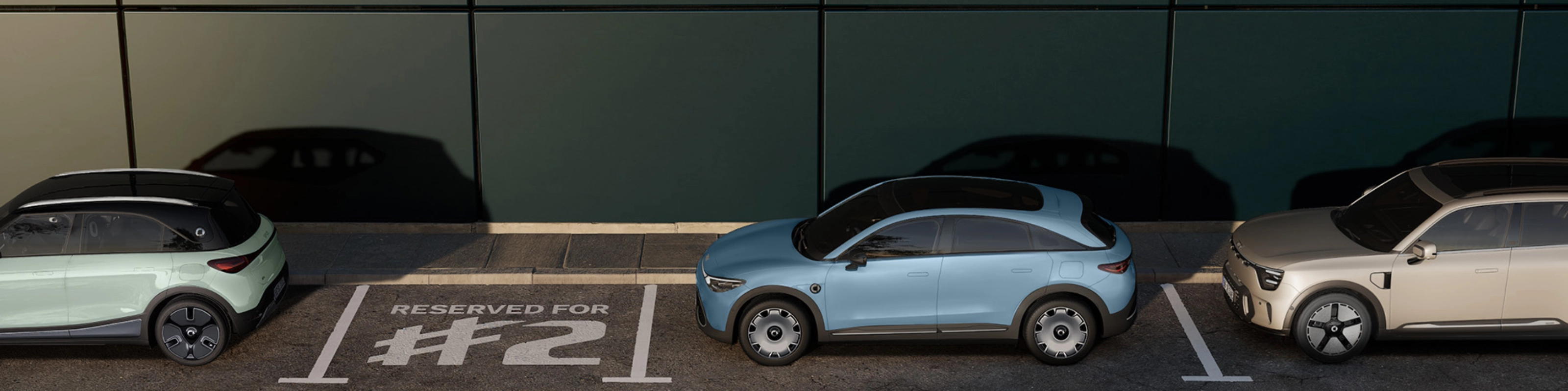 Three parked electric cars in front of a building, with one space marked "Reserved for #2".
