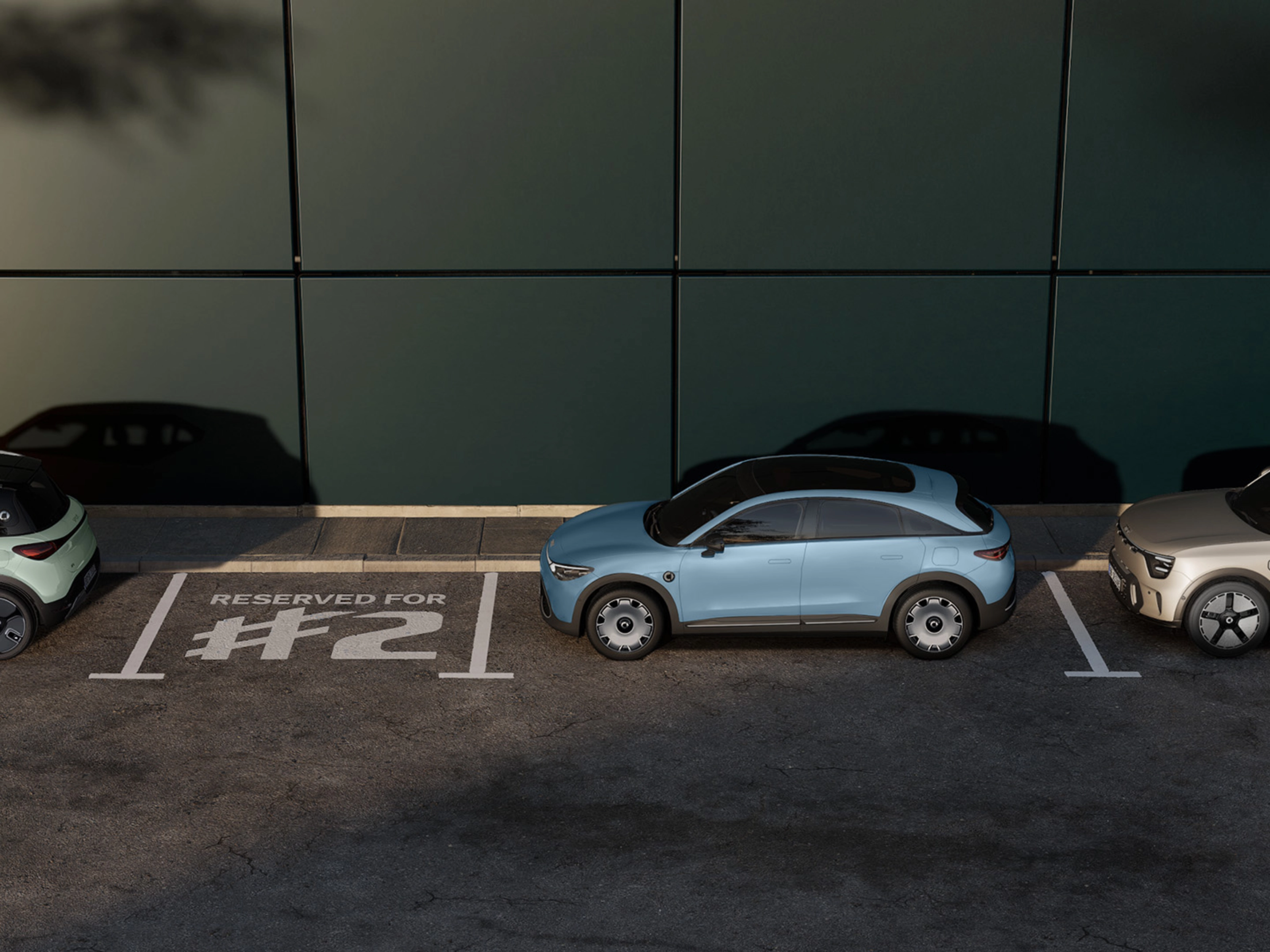 Three parked electric cars in front of a building, with one space marked "Reserved for #2".