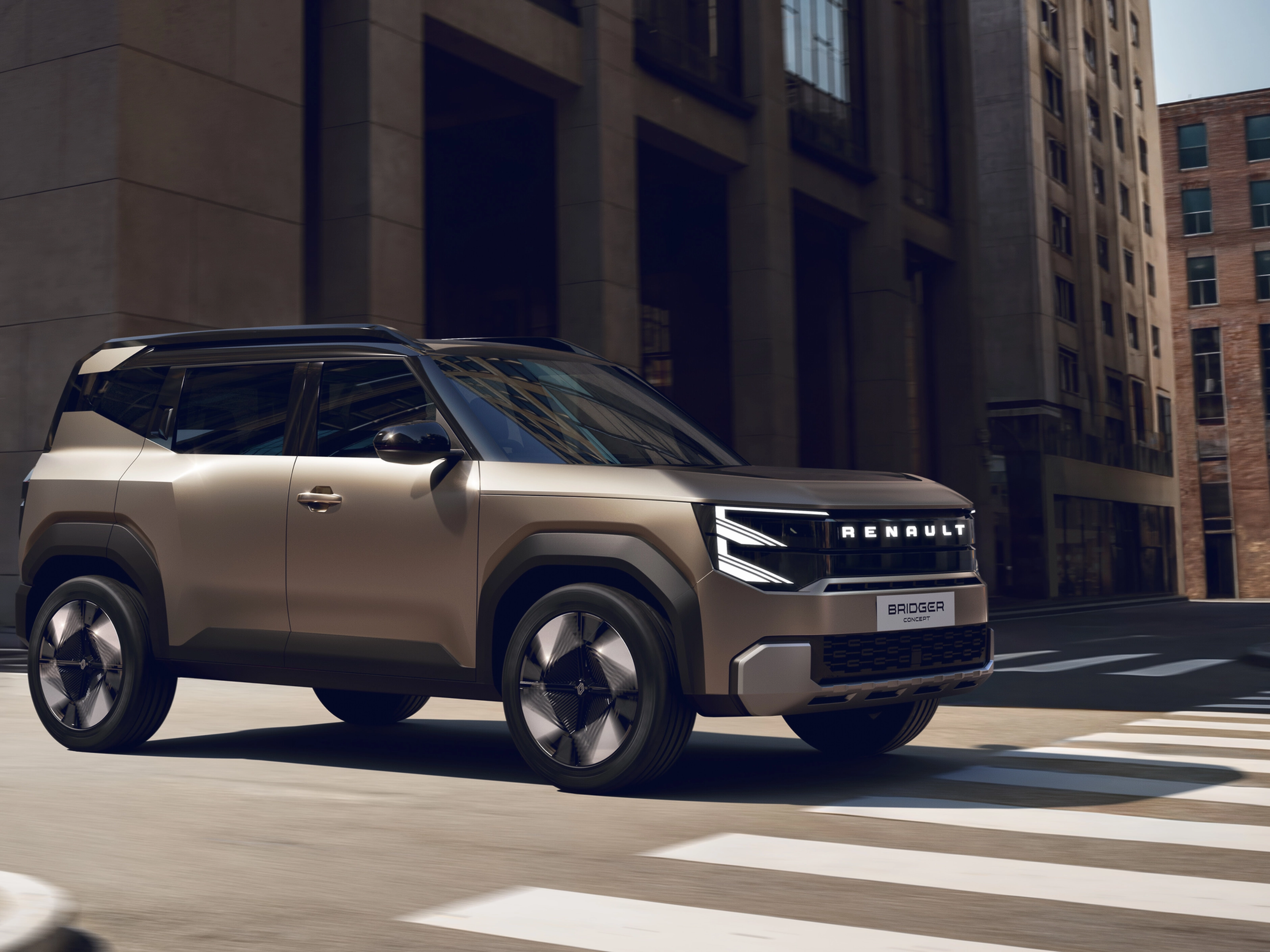 Renault Bridger Concept SUV driving through a modern city street.
