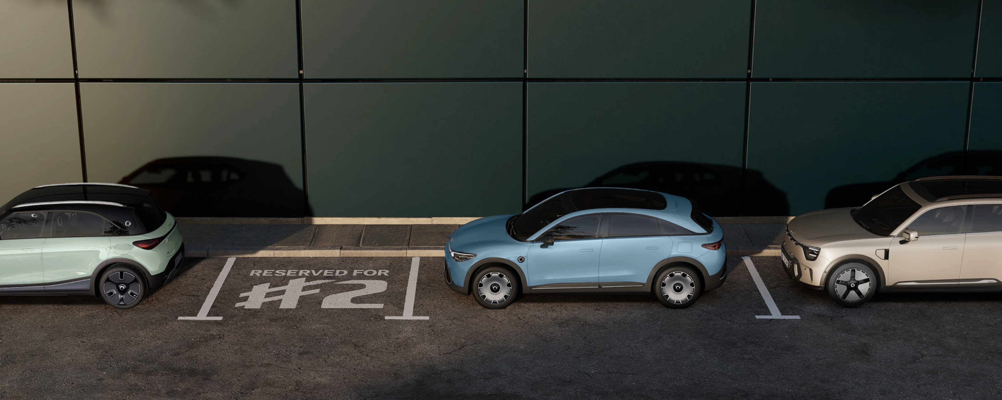 Three parked electric cars in front of a building, with one space marked "Reserved for #2".