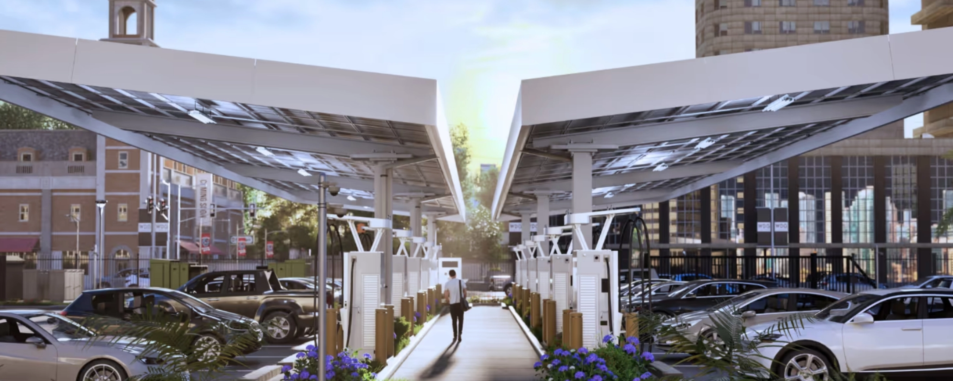 Ladestation für Elektroautos mit Solardächern auf einem Stadtparkplatz.
