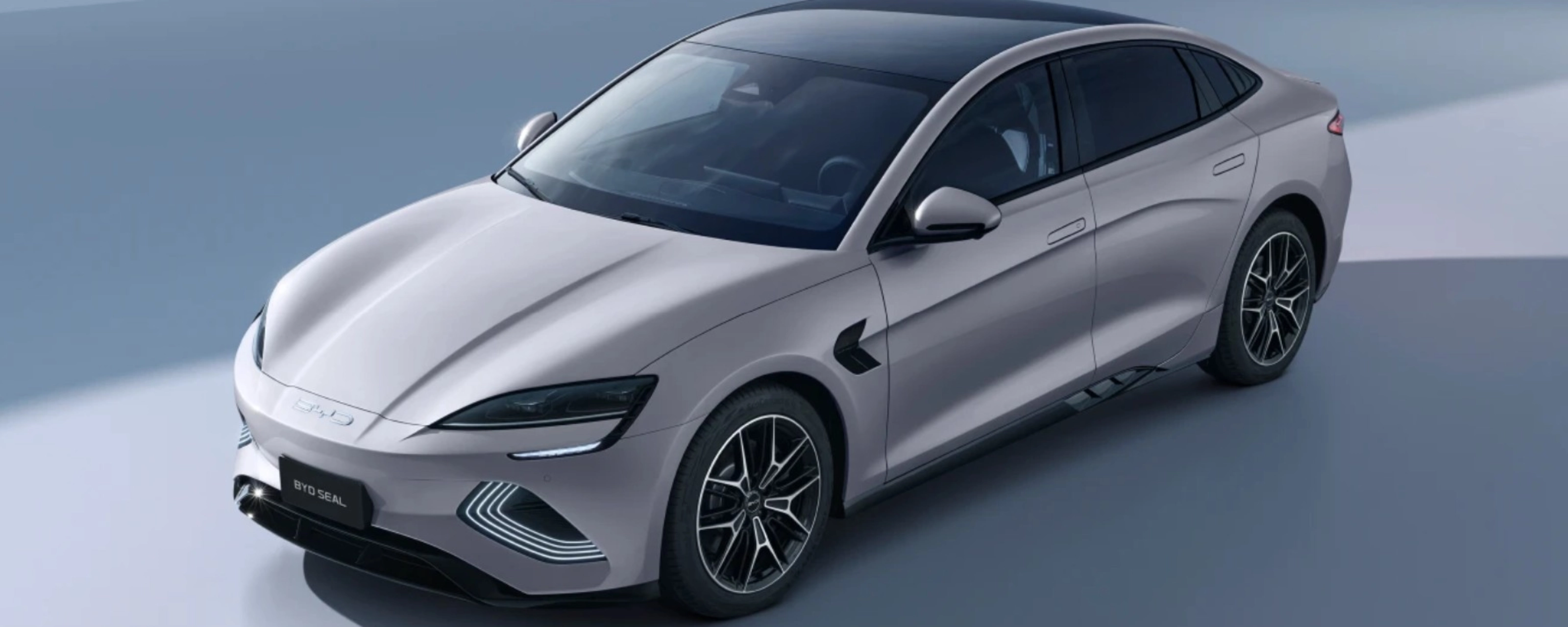 BYD Seal electric sedan in light gray, shown from a front-side angle.
