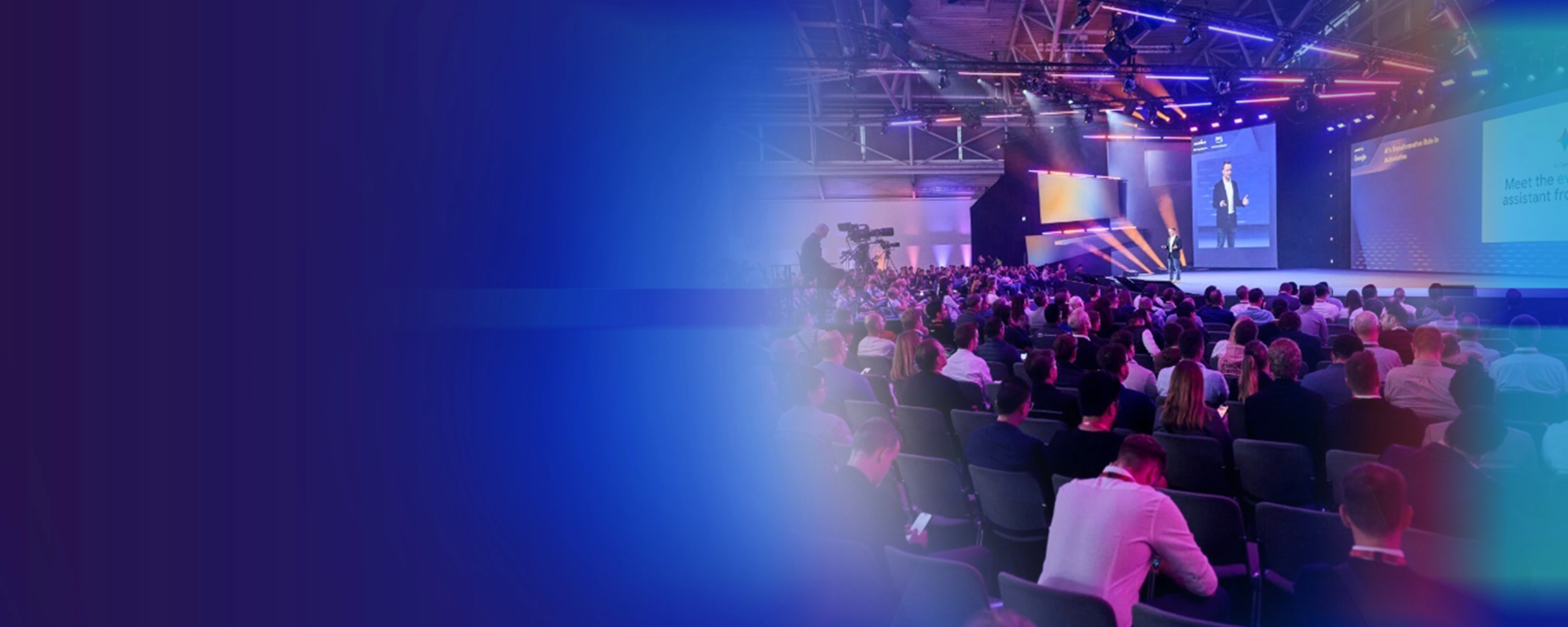 Promotional banner showing a conference audience and stage presentation.