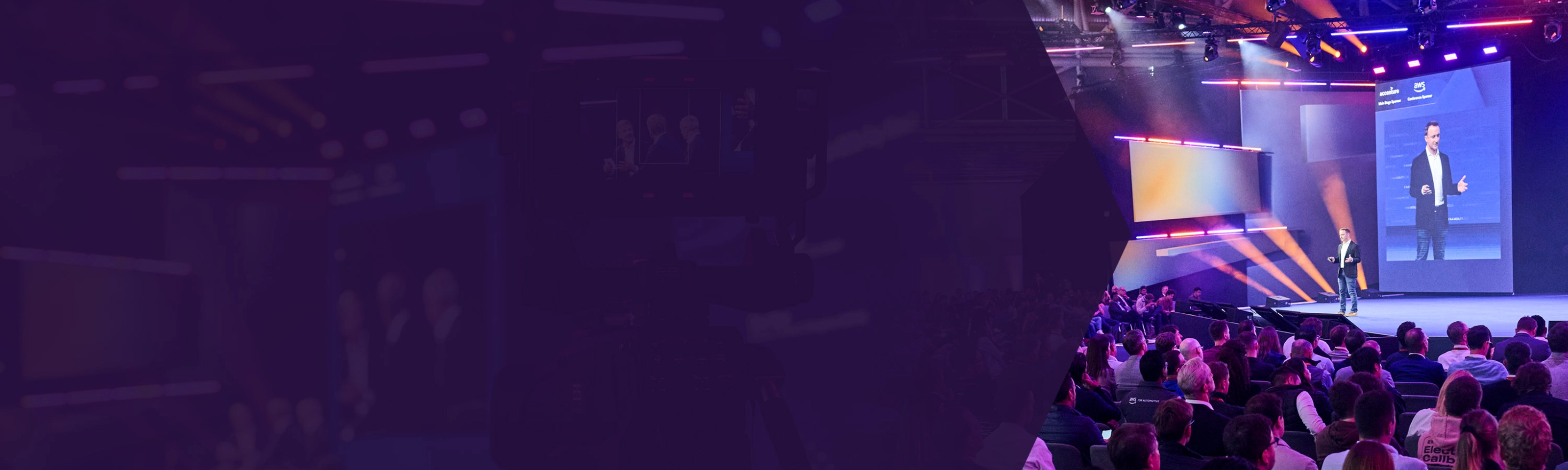 Speaker on stage at a tech conference with a large seated audience and colorful lighting.