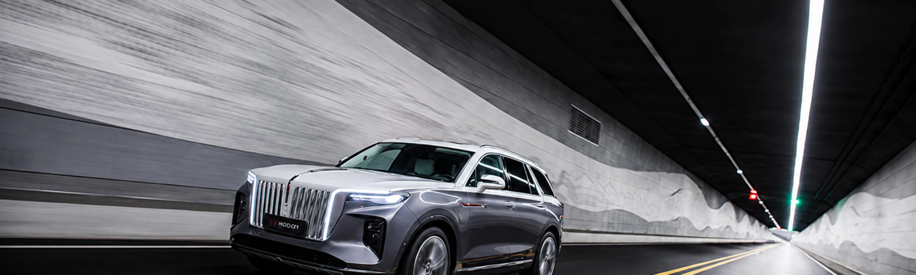 Hongqi SUV driving through a road tunnel.
