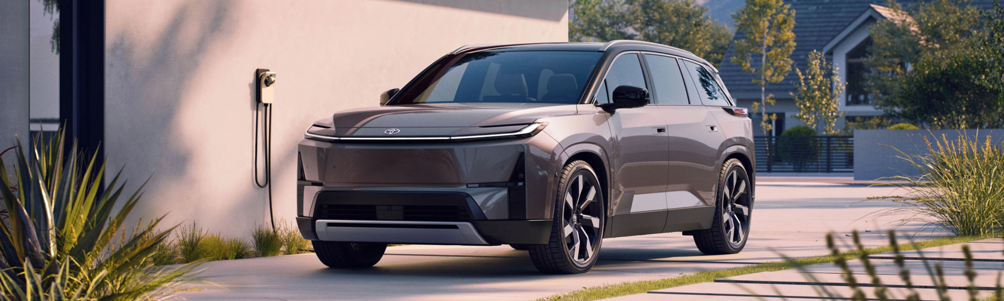 Electric SUV parked at home charging station.