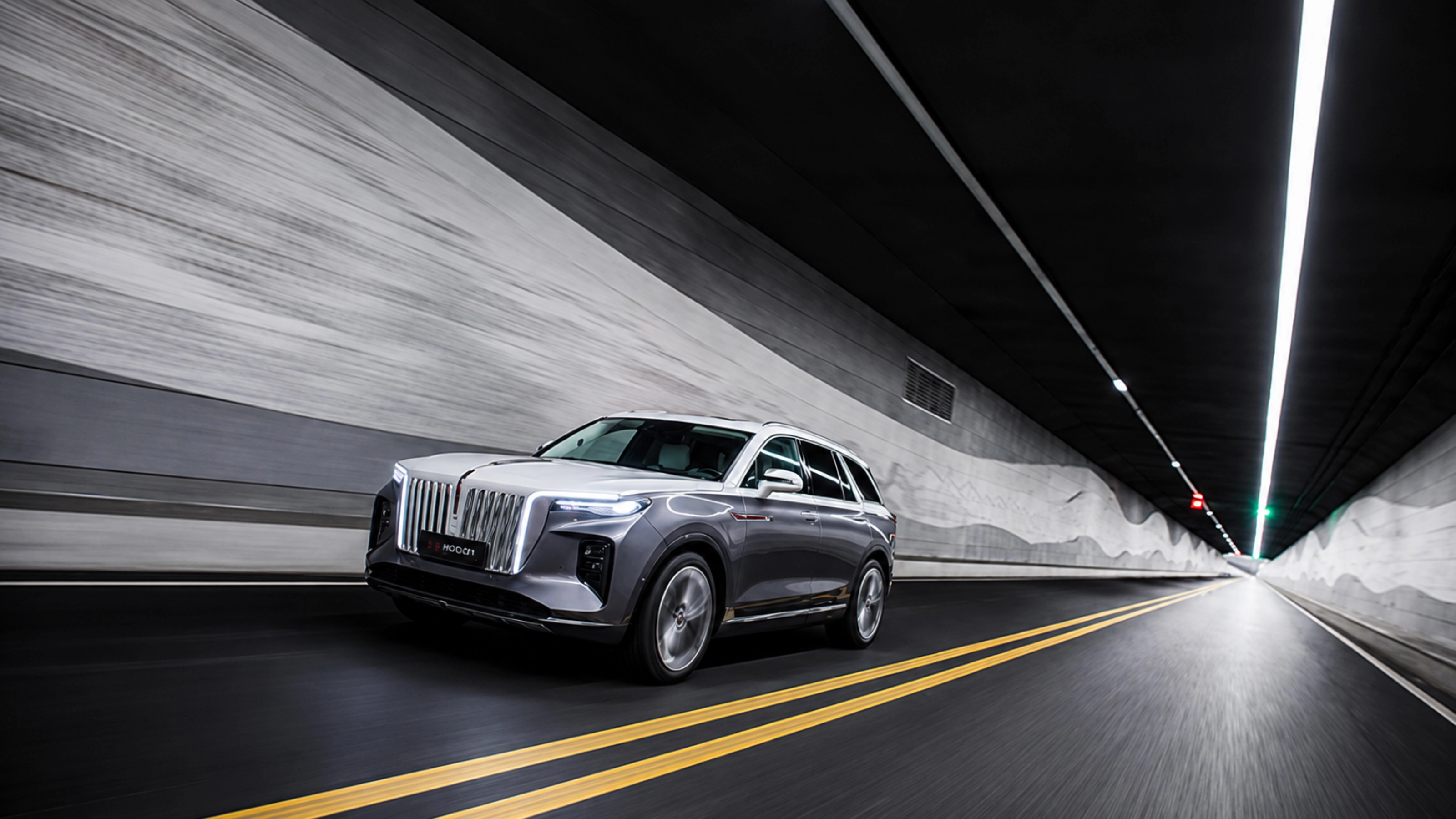 Hongqi SUV driving through a road tunnel.