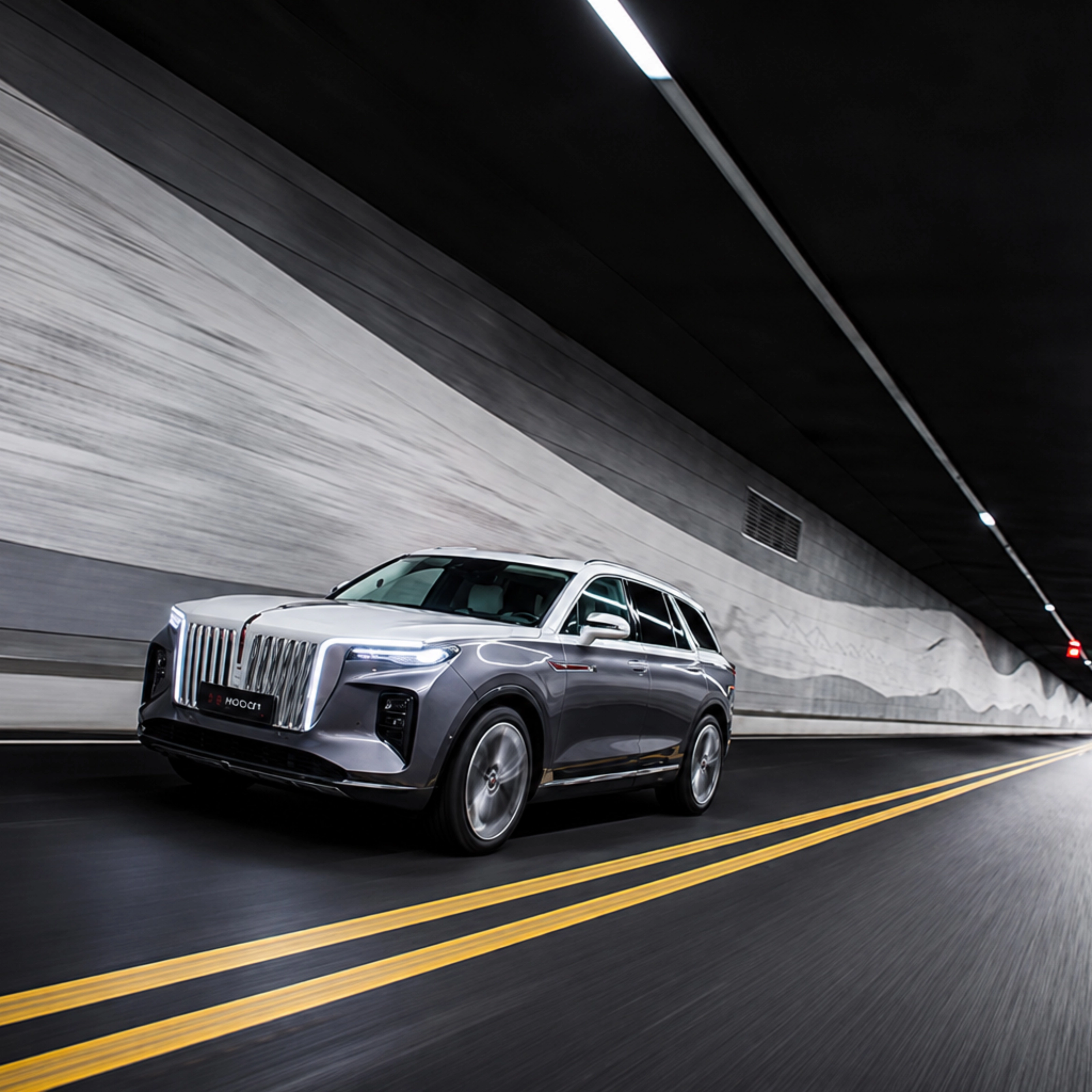 Hongqi SUV driving through a road tunnel.