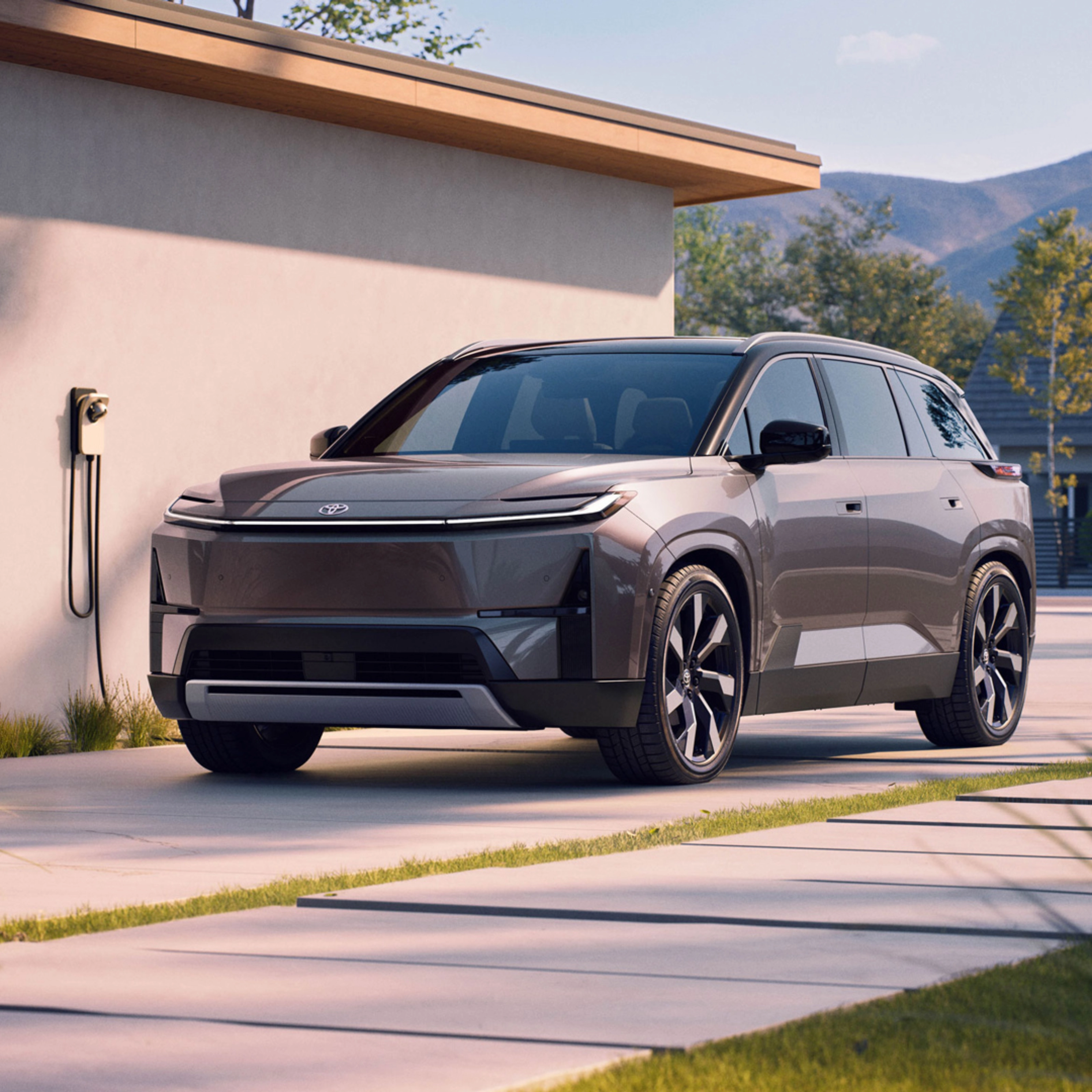 Electric SUV parked at home charging station.