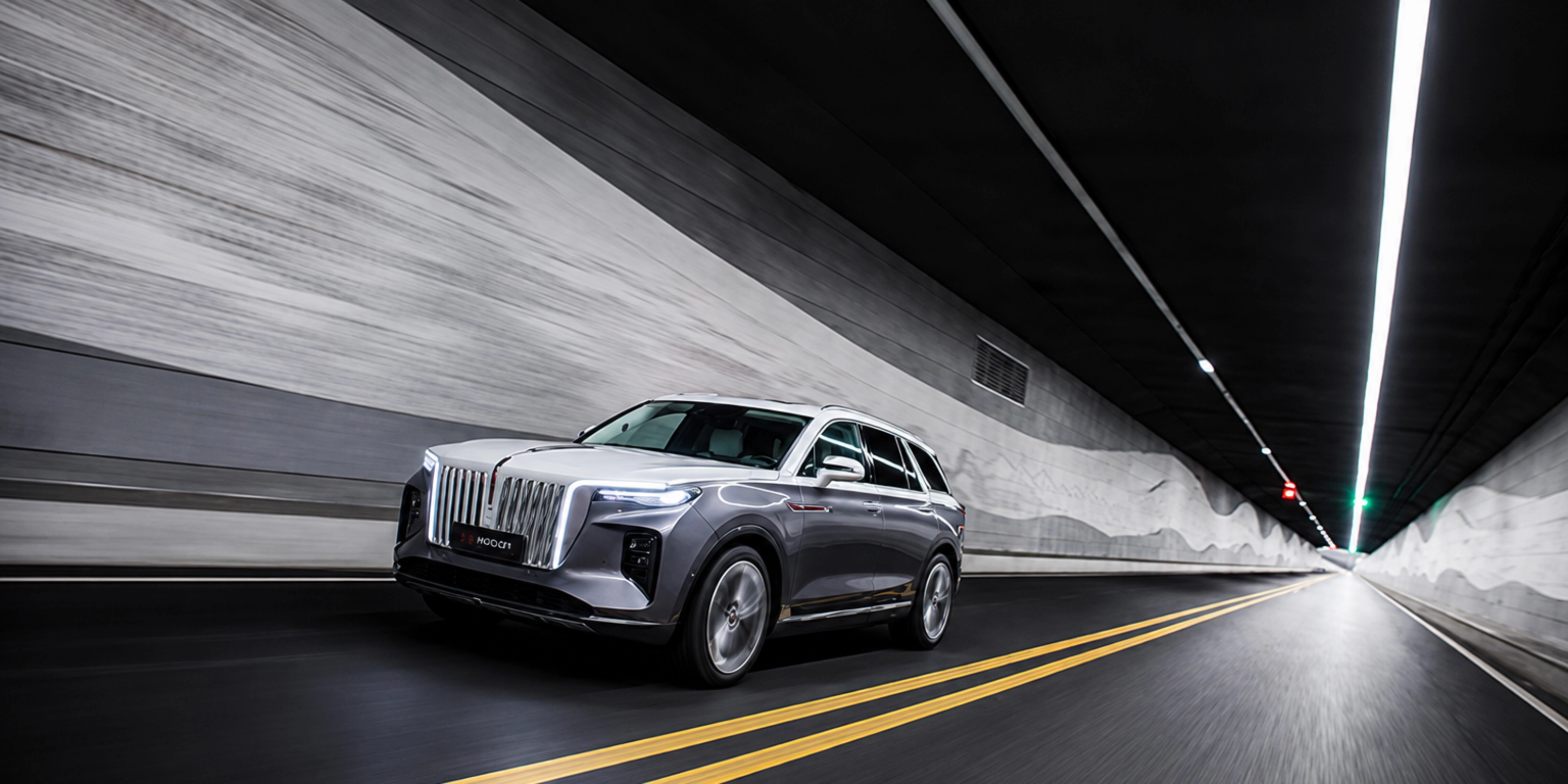 Hongqi SUV driving through a road tunnel.