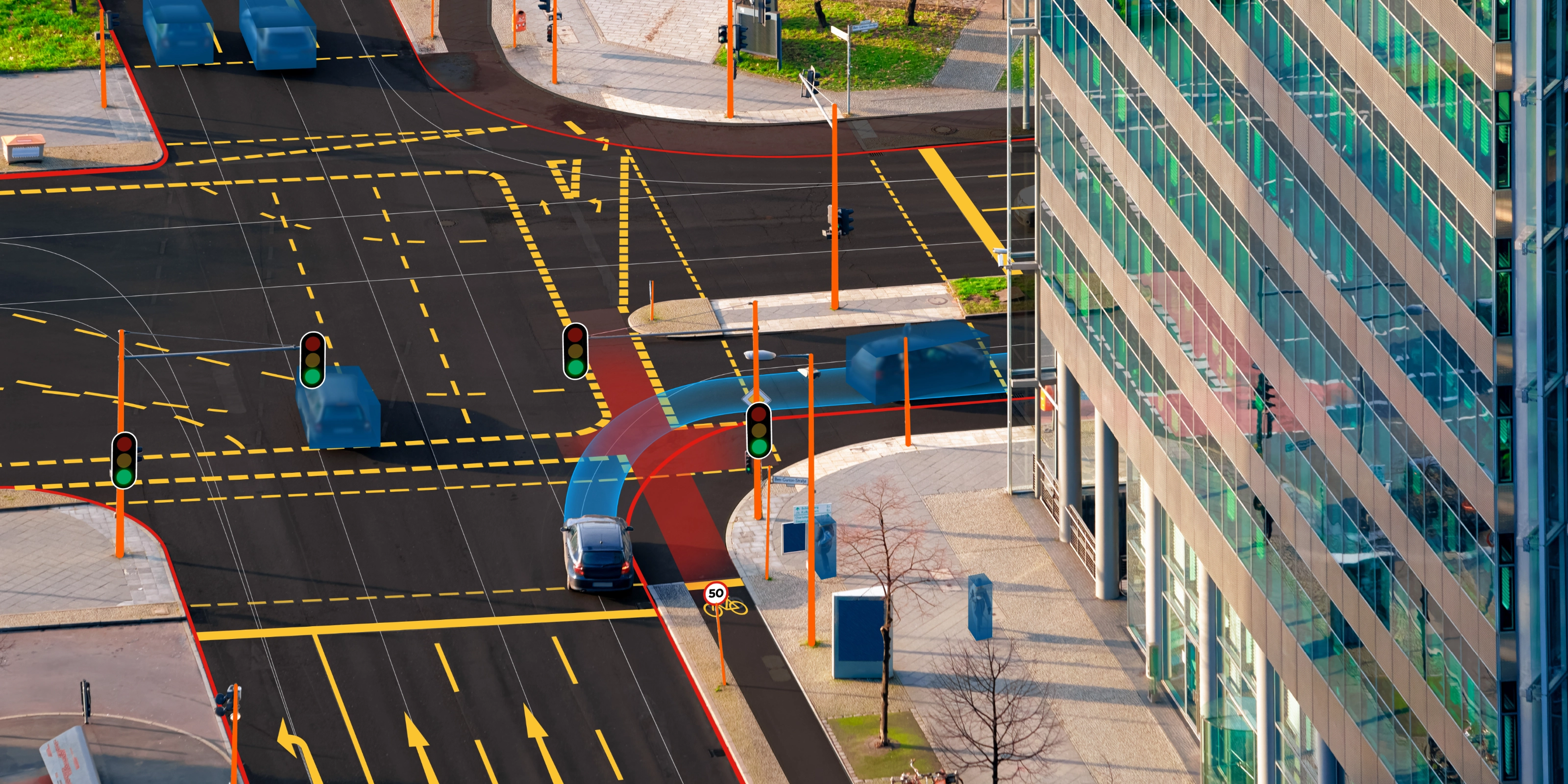 Städtische Kreuzung mit Ampeln, Busspur und gut erkennbaren Radwegen.