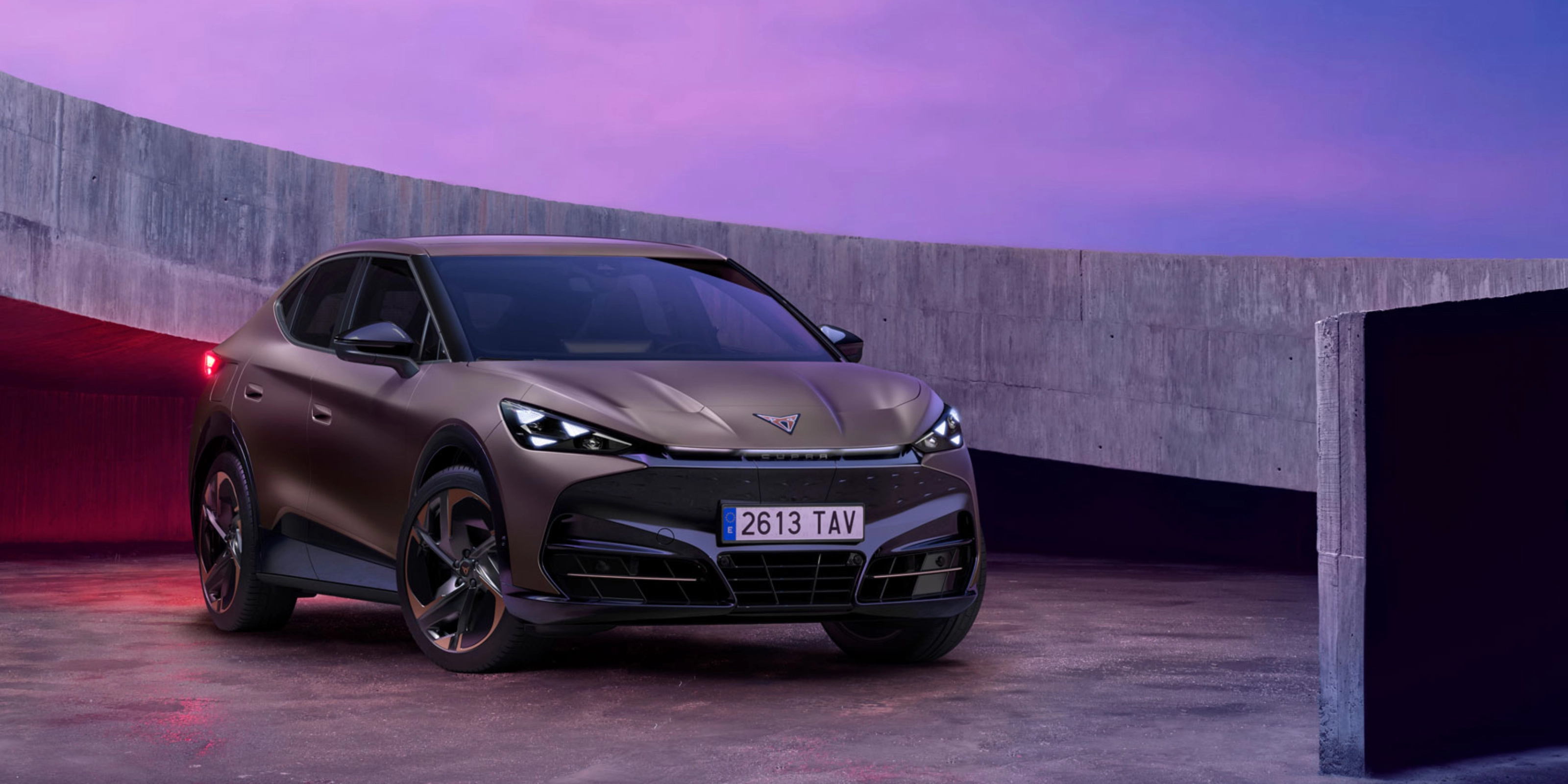 Cupra car parked in modern concrete setting with purple lighting.