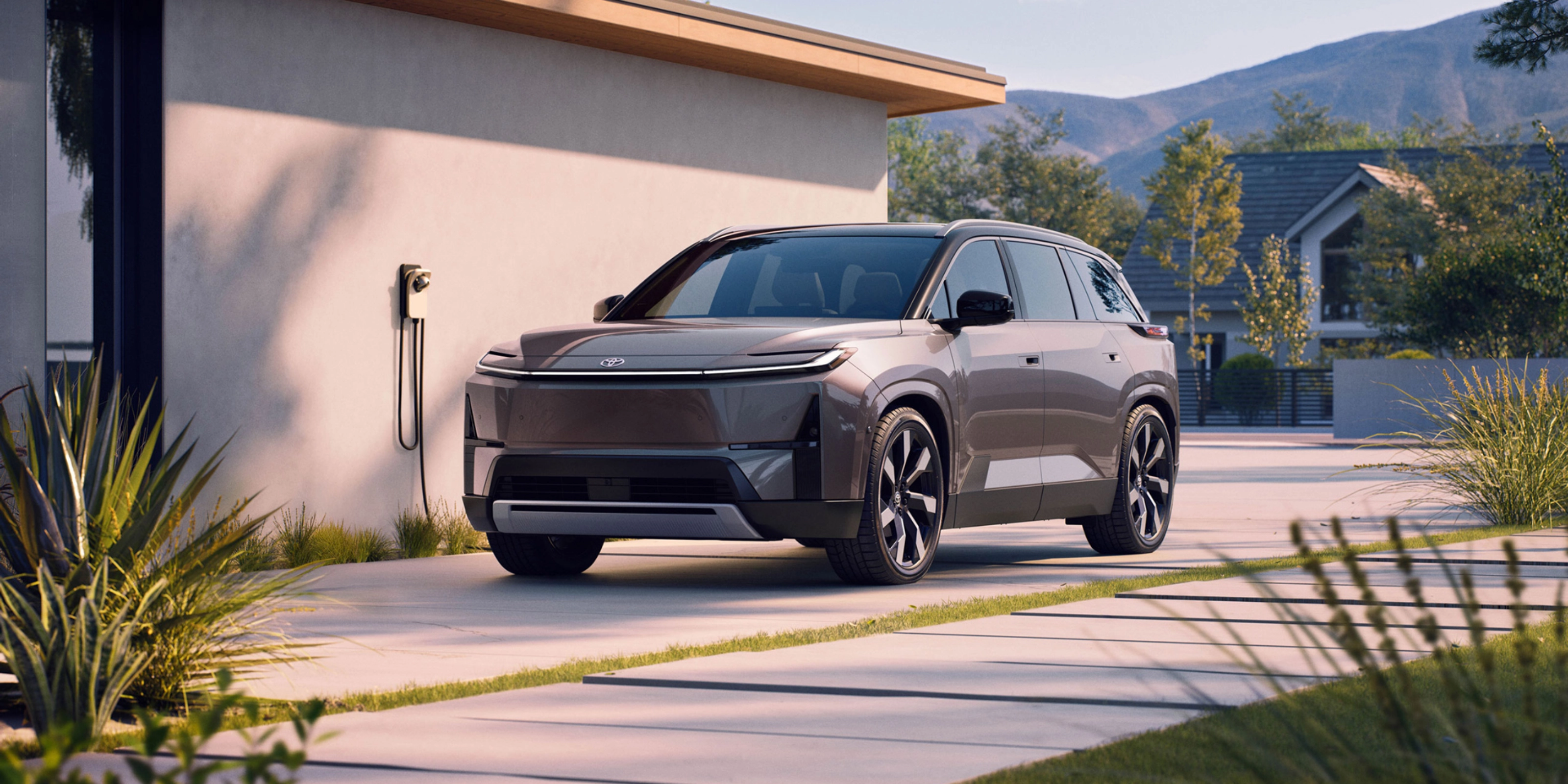 Electric SUV parked at home charging station.
