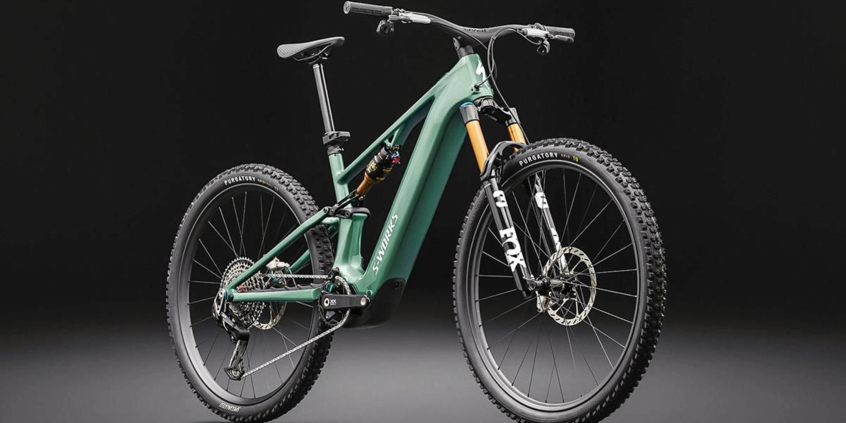 Green full-suspension mountain bike on a dark background.