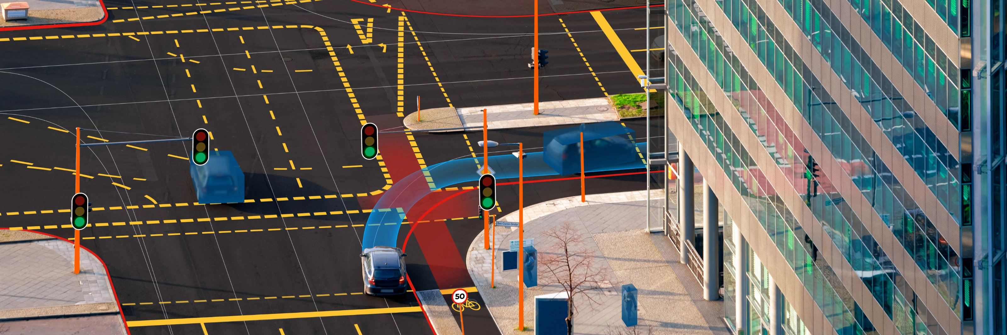 Städtische Kreuzung mit Ampeln, Busspur und gut erkennbaren Radwegen.