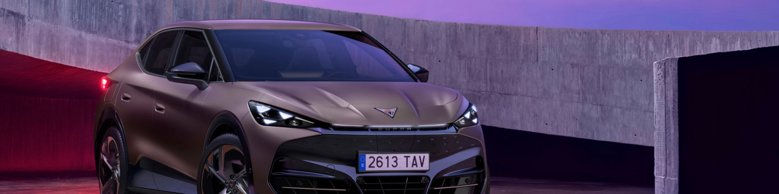 Cupra car parked in modern concrete setting with purple lighting.