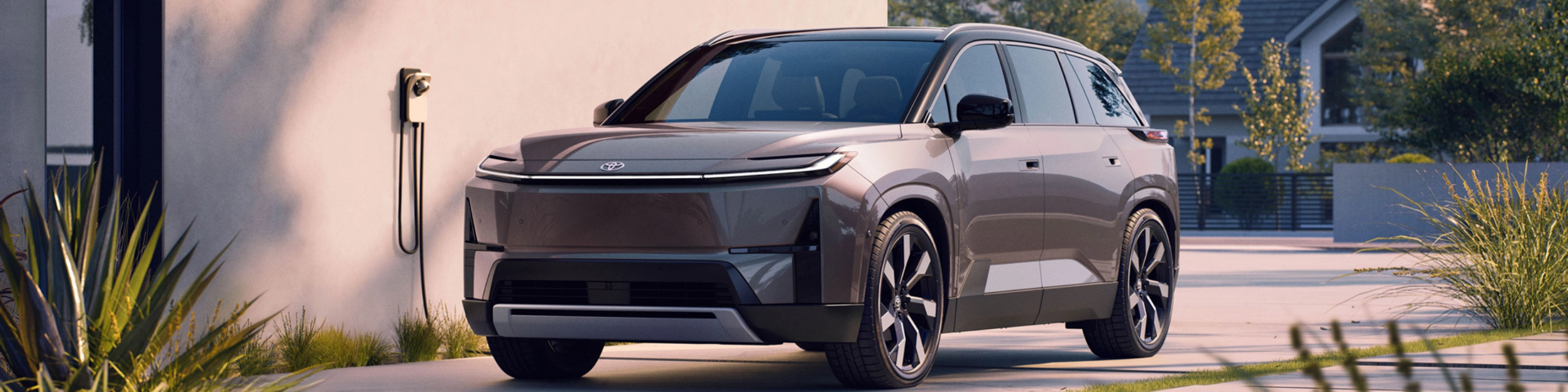 Electric SUV parked at home charging station.
