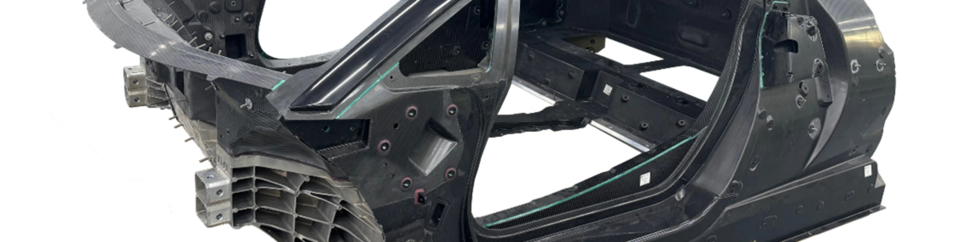 Carbon car monocoque chassis without exterior panels or interior components.