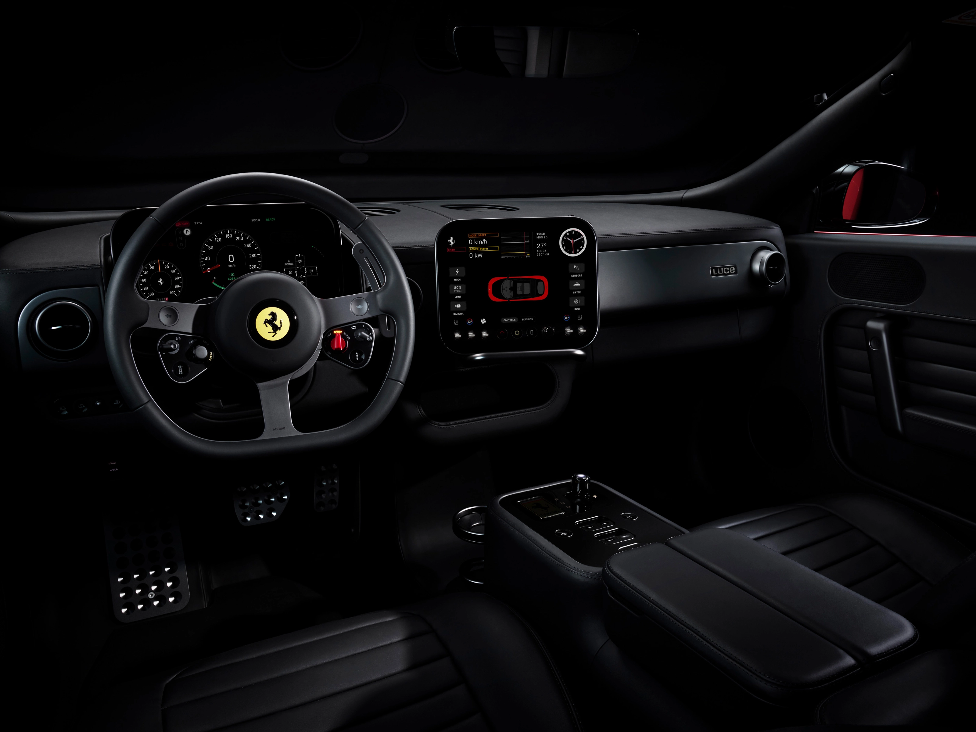 Dark Ferrari interior with illuminated dashboard and steering wheel.