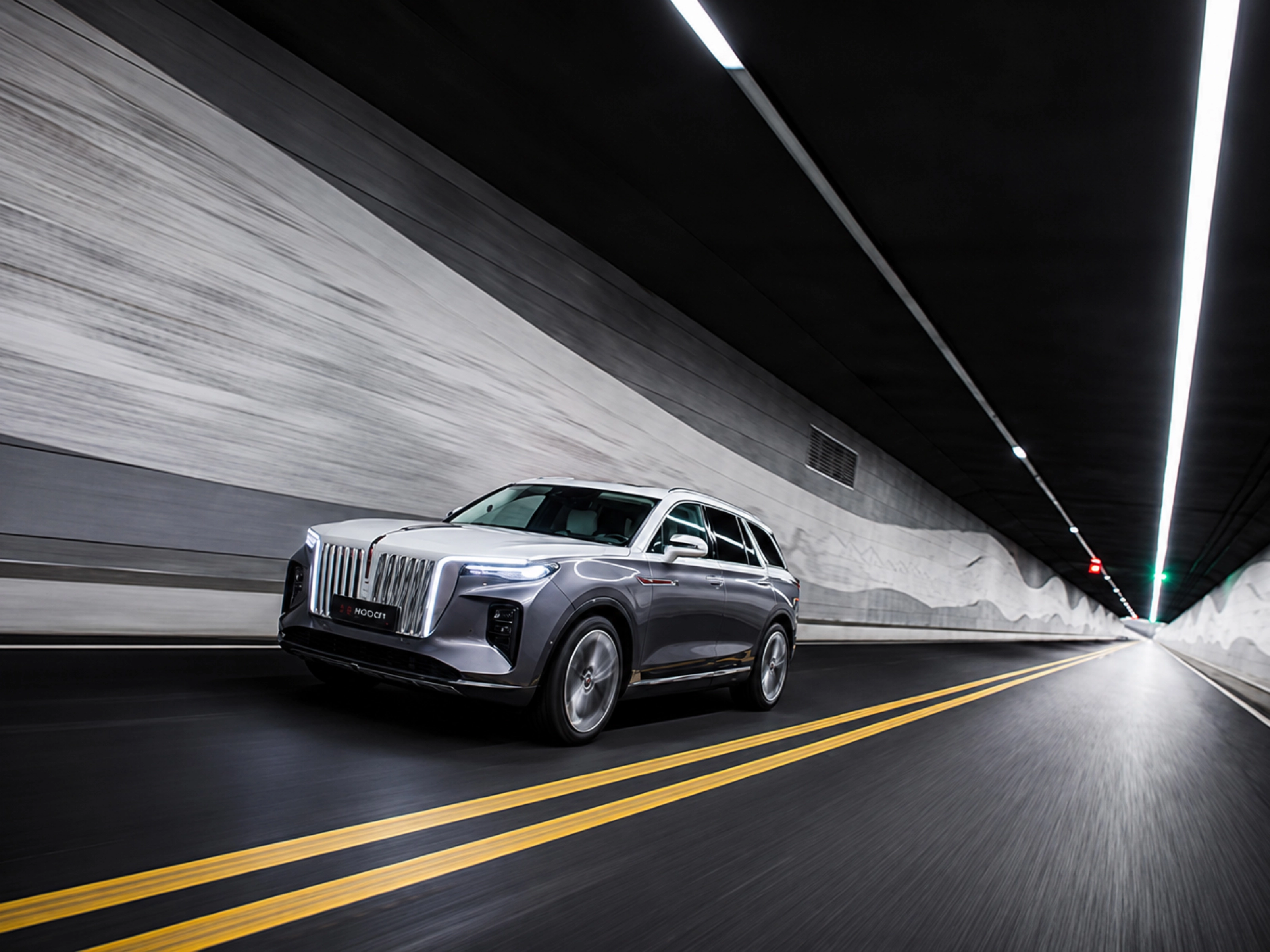 Hongqi SUV driving through a road tunnel.