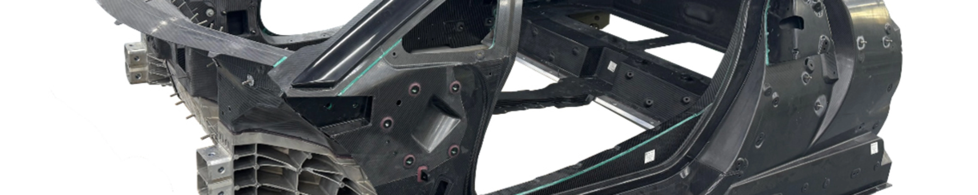 Carbon car monocoque chassis without exterior panels or interior components.