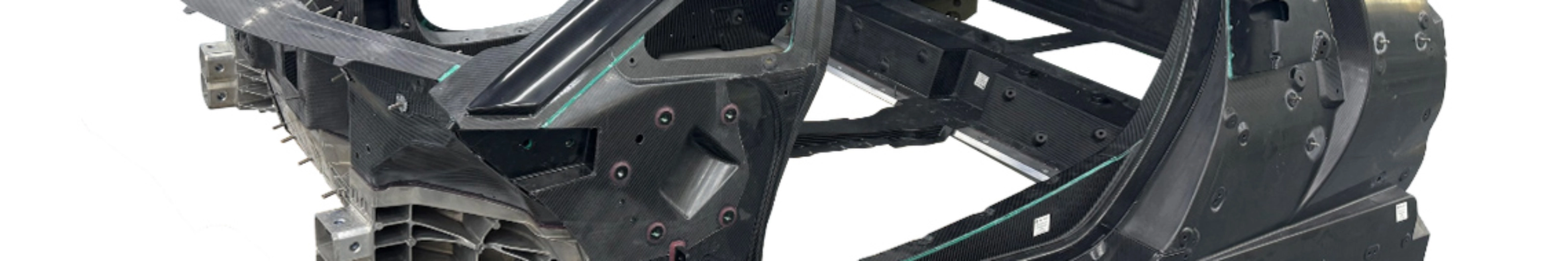 Carbon car monocoque chassis without exterior panels or interior components.