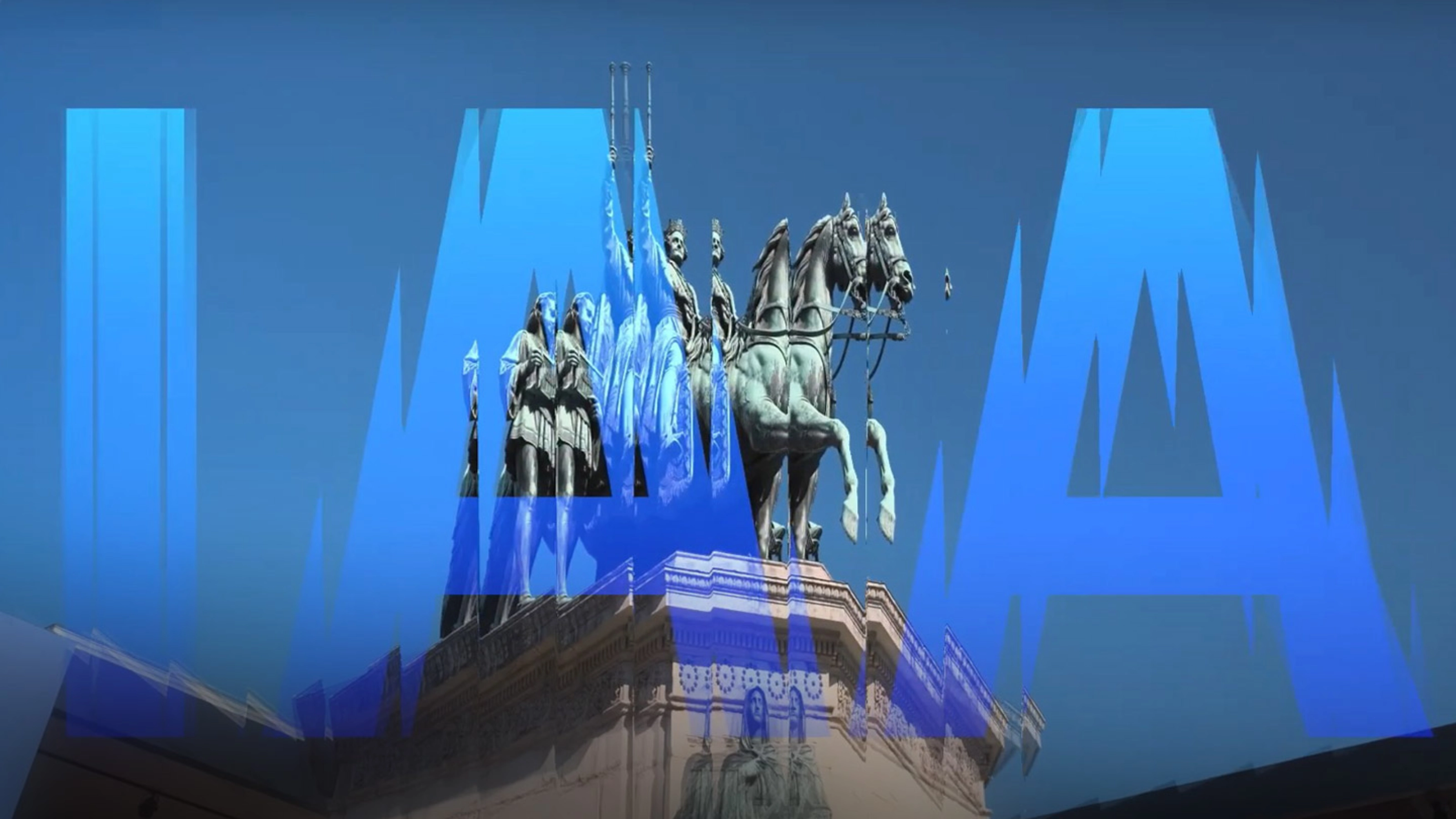 Thumbnail image of the IAA Munich auto show: Monument with equestrian statues overlaid by large blue letters spelling "IAA" on a clear sky.