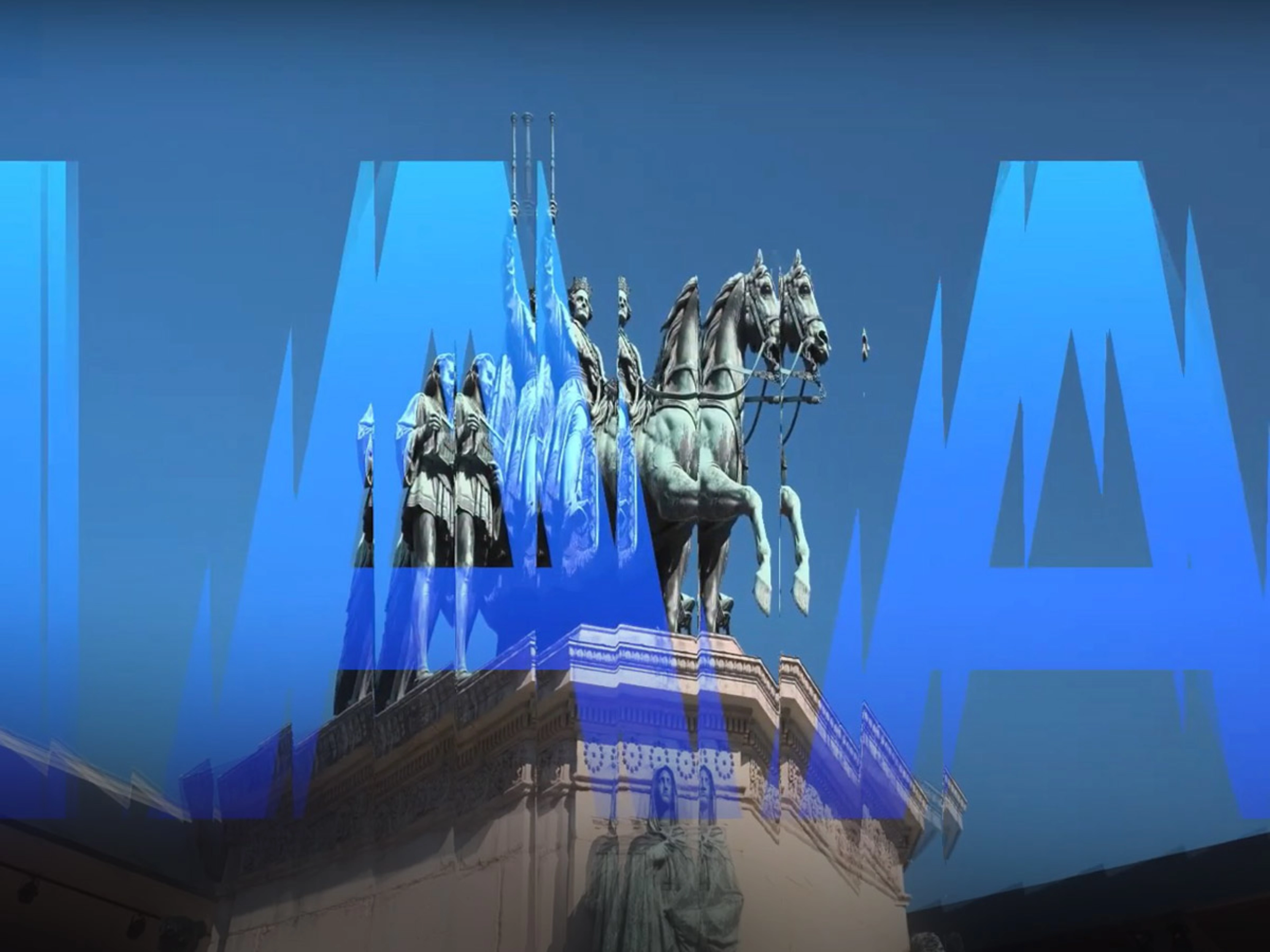 Thumbnail image of the IAA Munich auto show: Monument with equestrian statues overlaid by large blue letters spelling "IAA" on a clear sky.