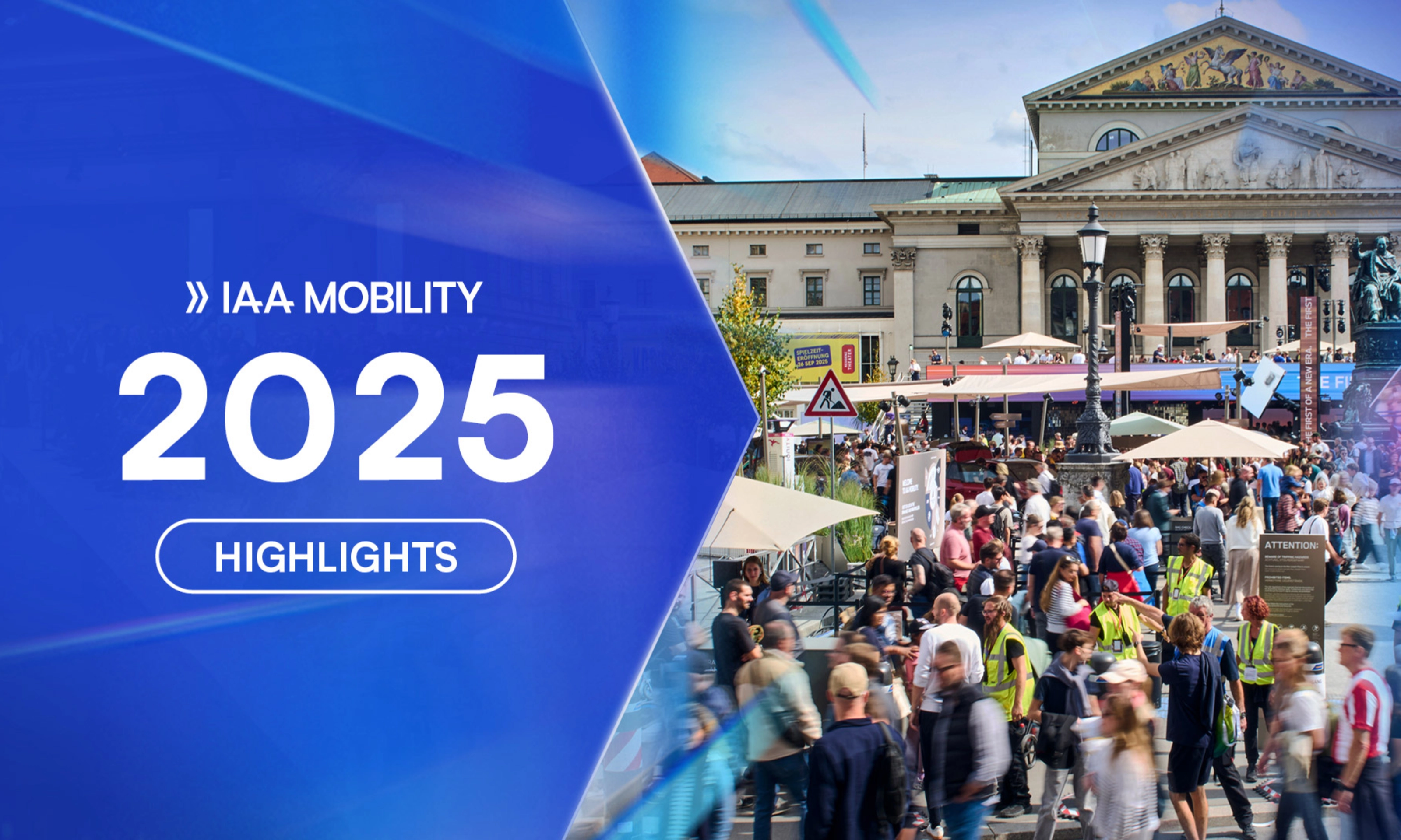 Crowds visit the IAA Mobility 2025 outdoor exhibition in front of a historic building in Munich.