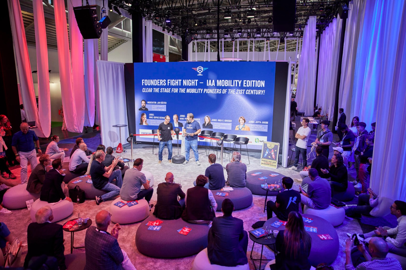 Audience watches a startup pitch event called Founders Fight Night at IAA Mobility.