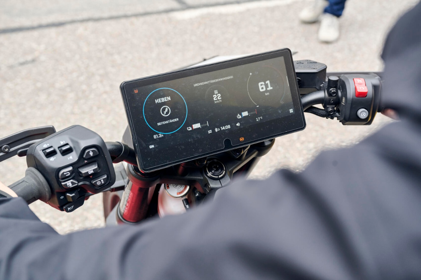 Digital motorcycle display showing speed, range and vehicle information.