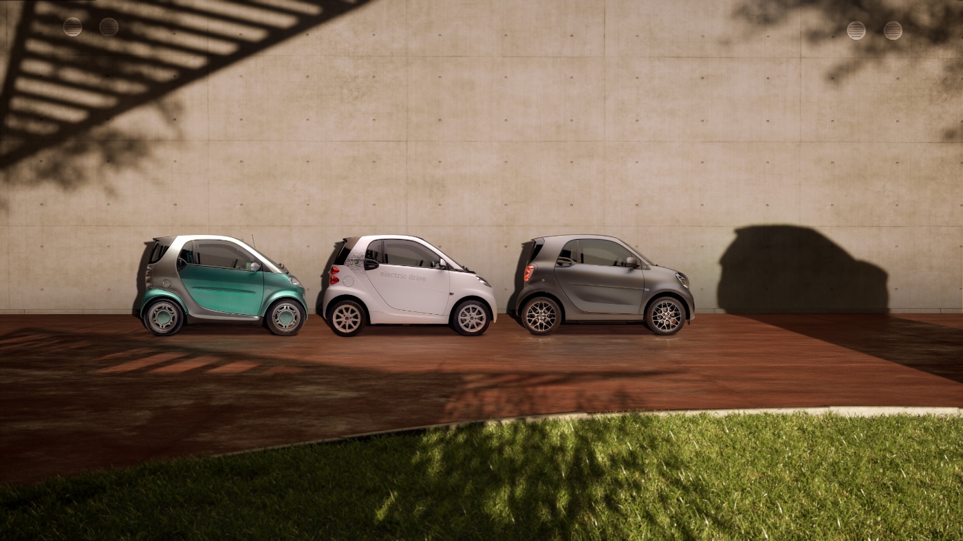 Three small electric cars are parked in a row, casting a large SUV-shaped shadow on the wall.