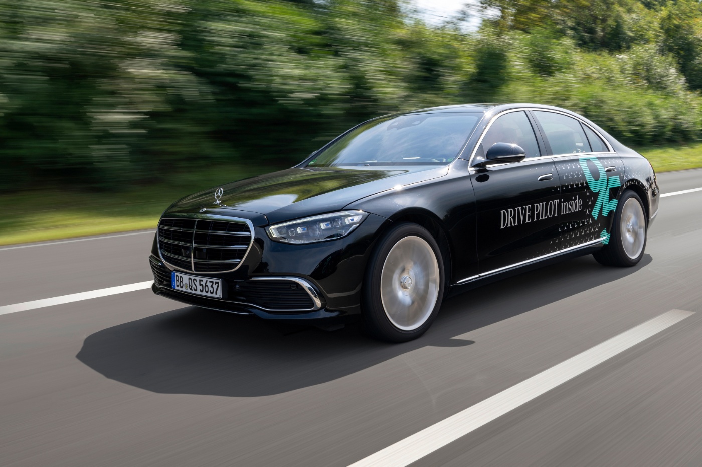 A Mercedes-Benz vehicle equipped with autonomous driving technology is being tested on a public road.
