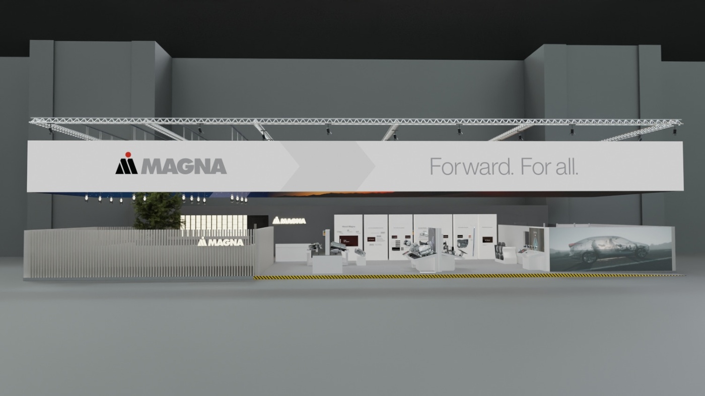 Exhibition booth of Magna with slogan "Forward. For all." and various automotive displays.