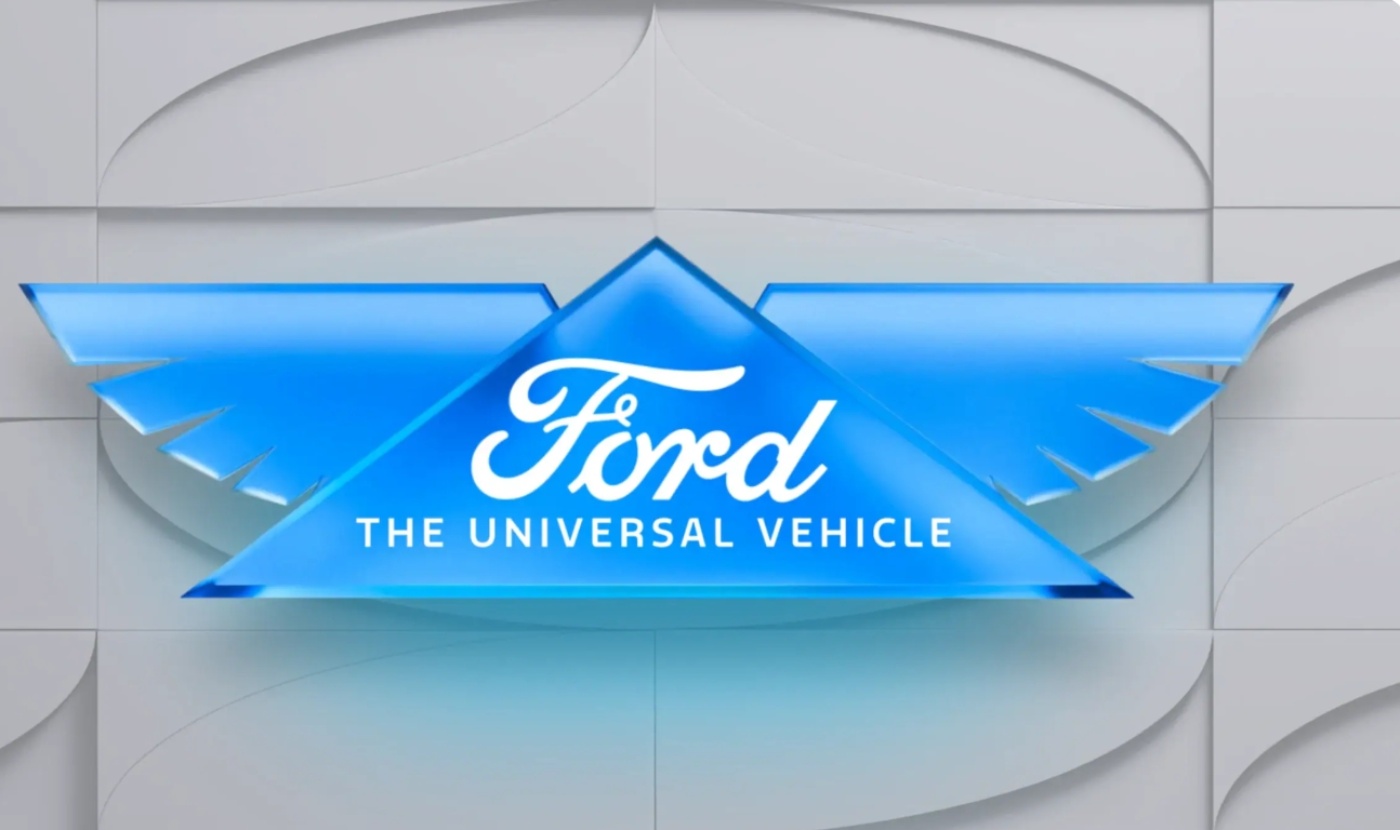Blue Ford logo with wing design and the slogan "The Universal Vehicle" on a light background.
