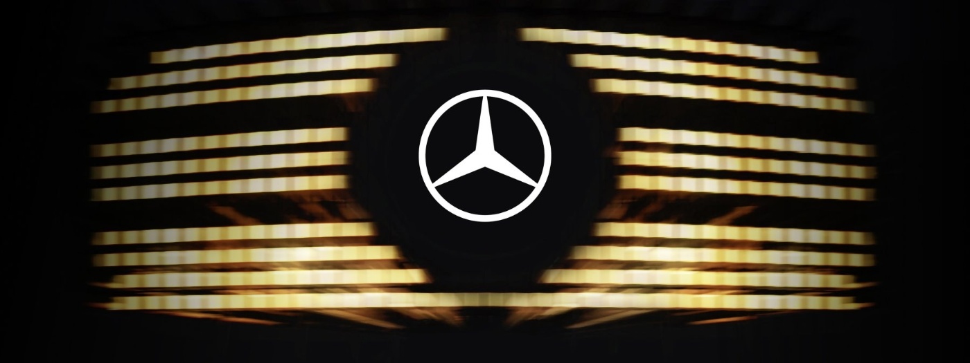 Mercedes star logo centered on a black background with horizontal yellow glowing lines.