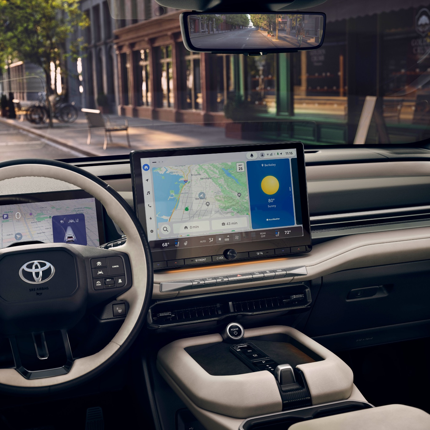 Car dashboard with navigation screen and street view.