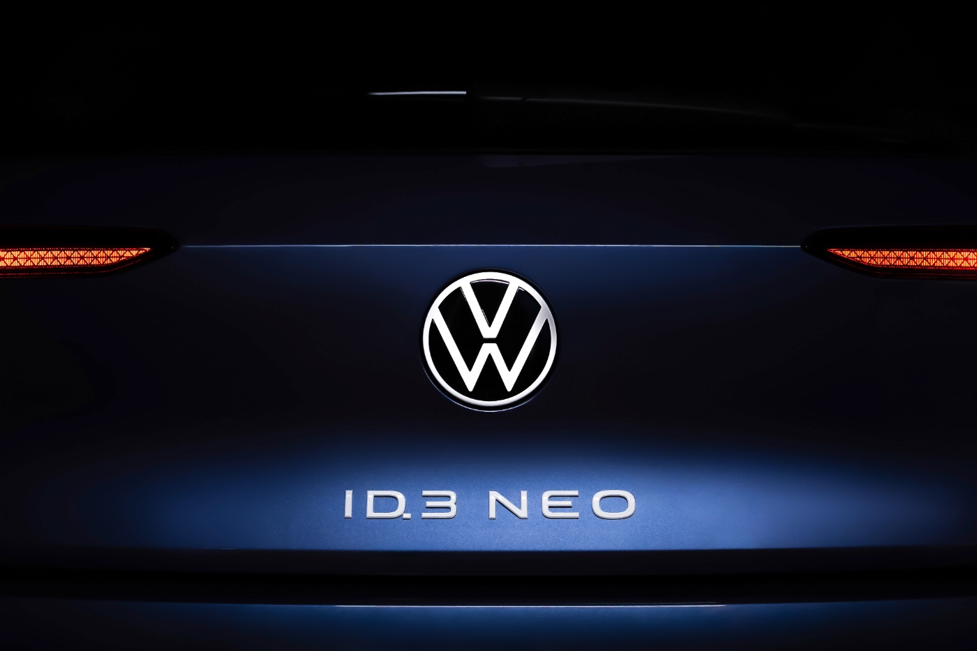 Rear view of Volkswagen ID.3 Neo with illuminated logo.