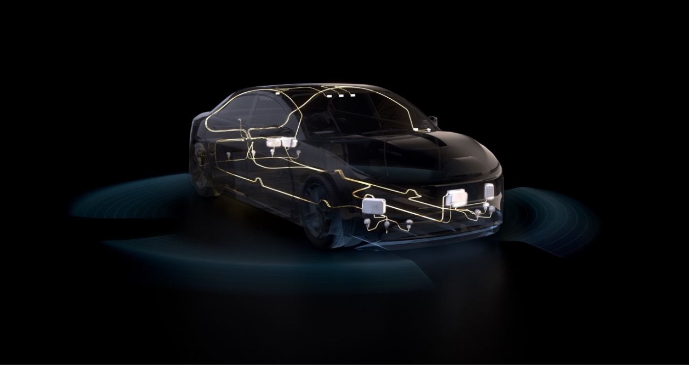 Transparent car with visible electronic systems and glowing sensor waves around it.