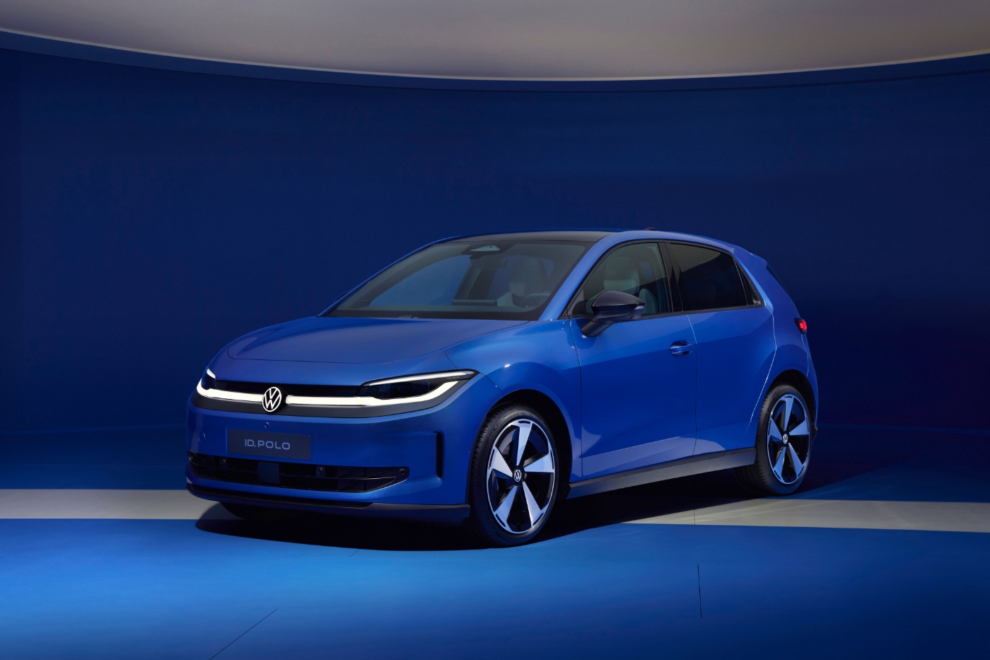 Blue Volkswagen ID.Polo parked in a blue studio setting.